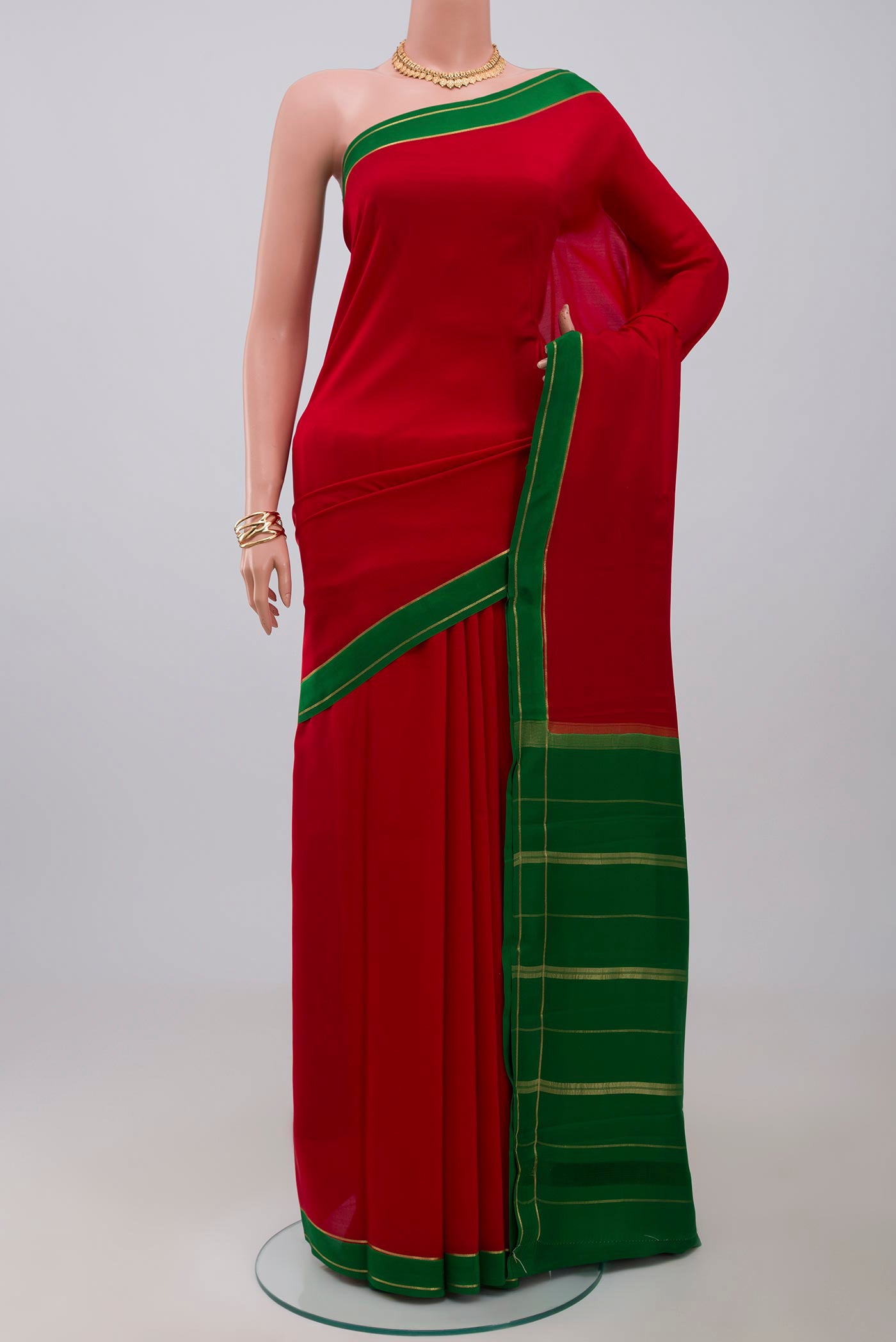 Pure Silk Pure Zari Red Mysore Silk Saree with Plain Body and Thin Zari Line.  displayed on a mannequin