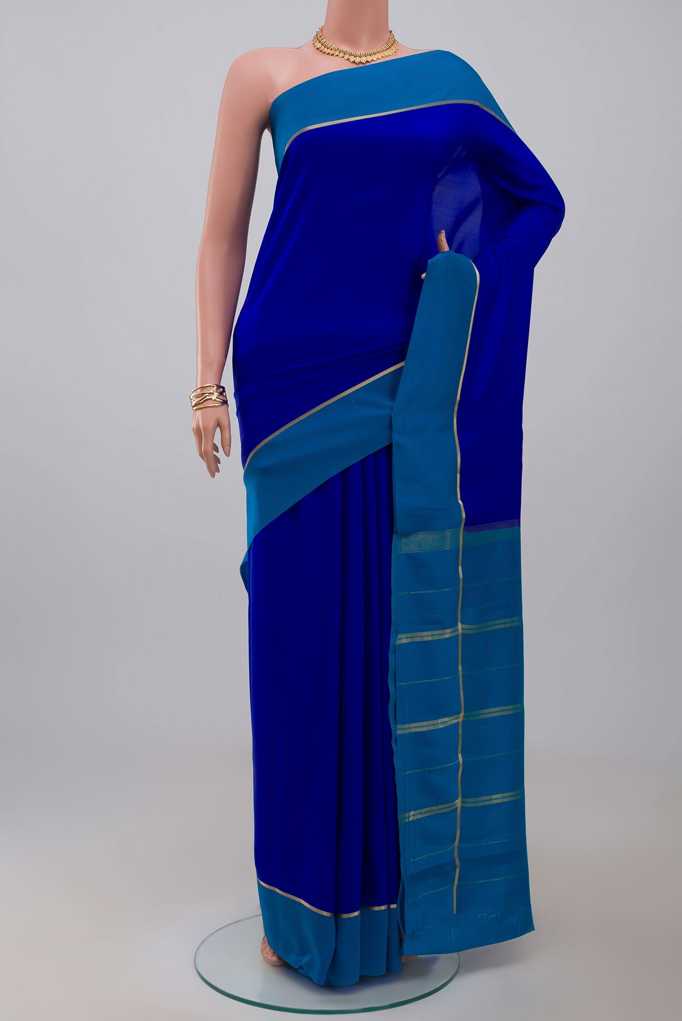 Pure Silk Pure Zari Dark Blue Mysore Silk Saree with Plain Body and Thin Zari Line.  displayed on a mannequin