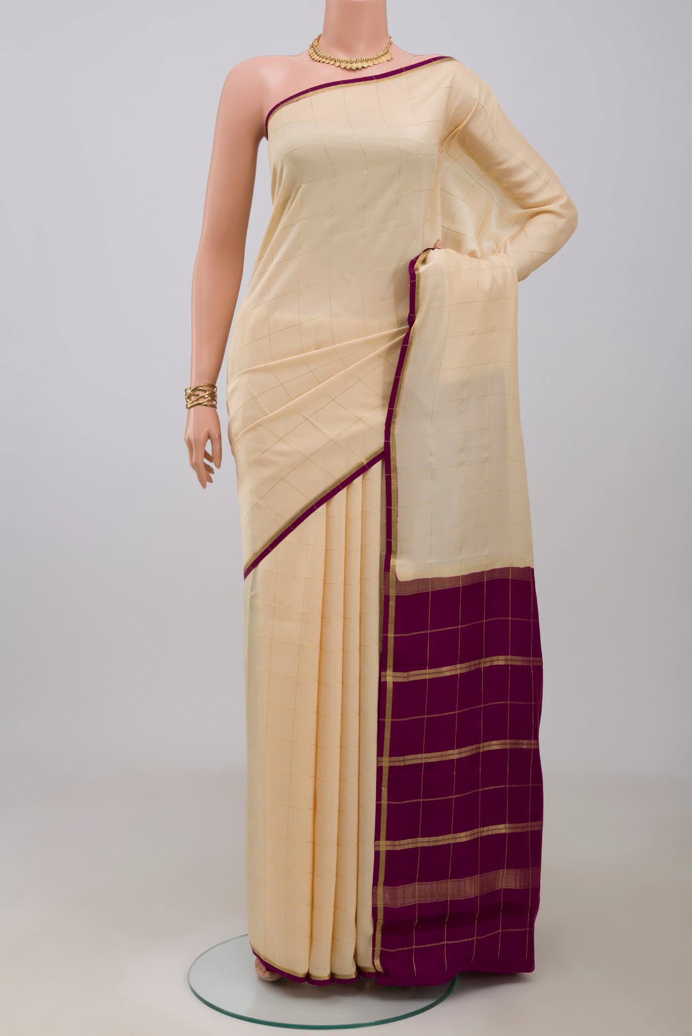 Pure Silk Pure Zari Cream Mysore Crepe Saree with Checked design on the body and Thin Zari Line.  displayed on a mannequin