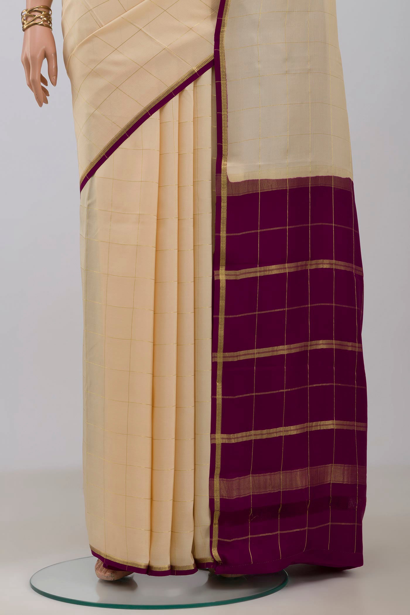 Pleats and pallu of Pure Silk Pure Zari Cream Mysore Crepe Saree with Checked design on the body and Thin Zari Line. 