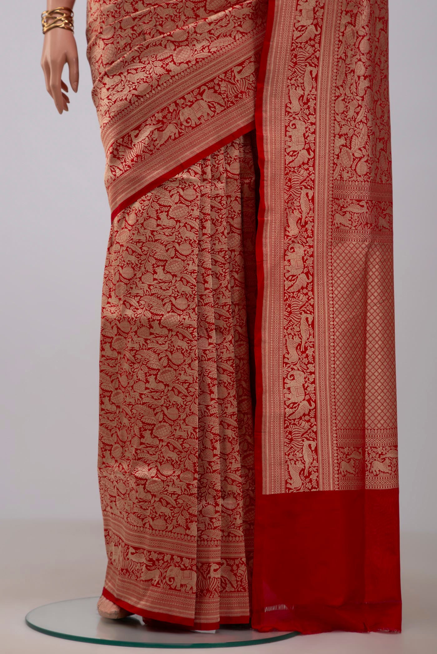 Pleats and pallu of Red Banarasi Silk Saree with Zari Brocade on the body and Fancy Border. 