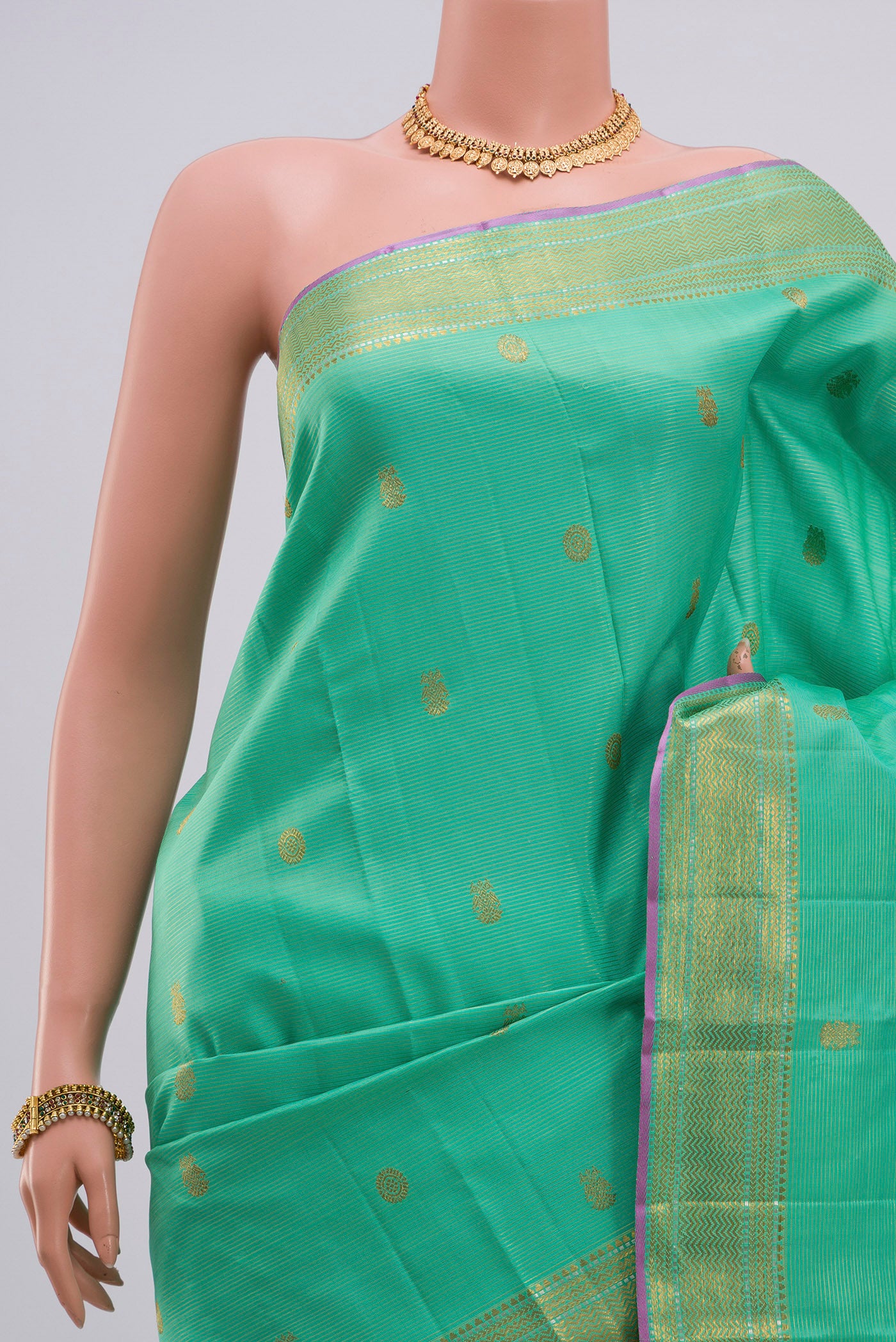 Border image of Green Kanjivaram Saree with Zari Butta on the body and Zari Border. 