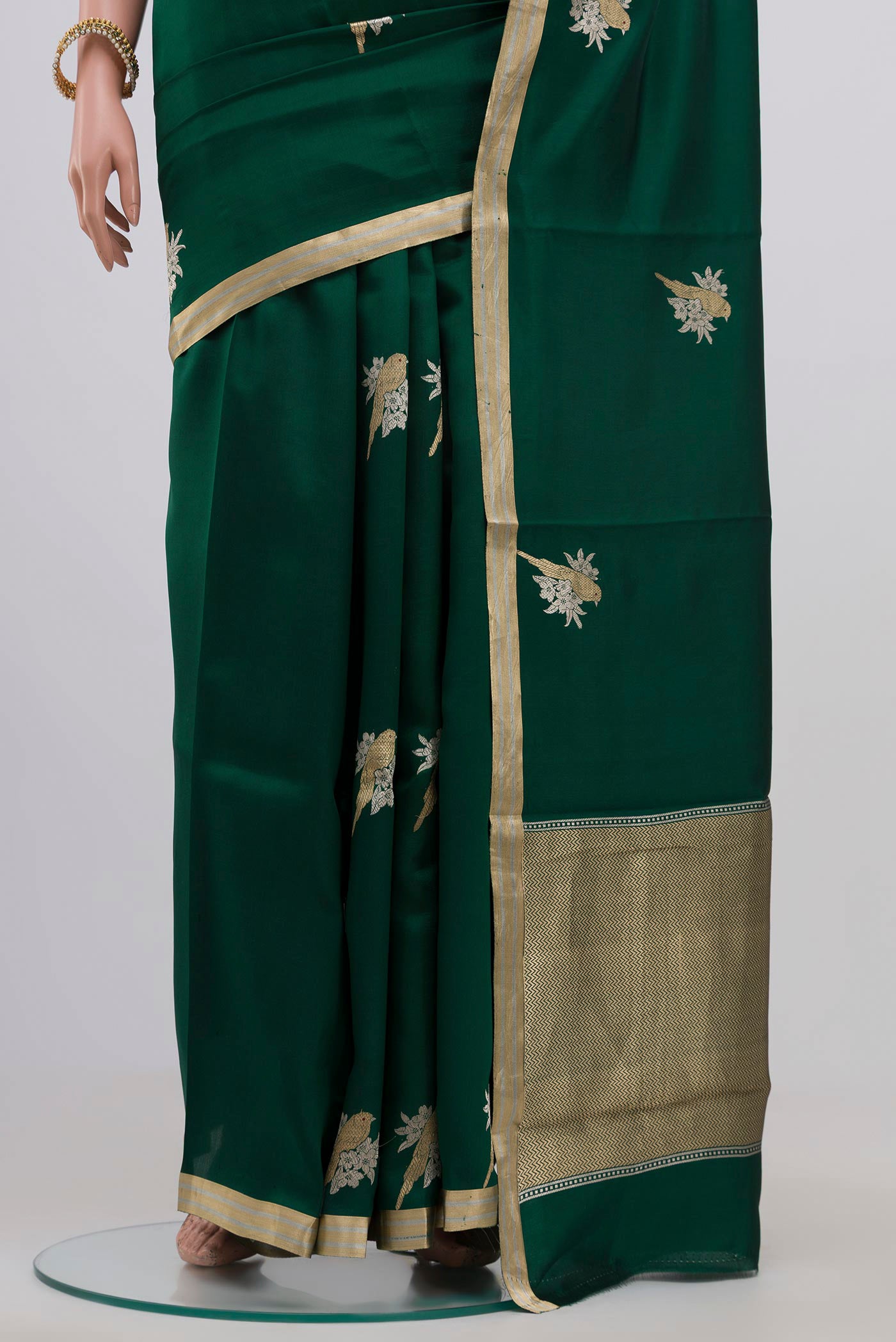 Pleats and pallu of Bottle Green Banarasi Katan Silk Saree with Zari Butta on the body and Zari Border. 