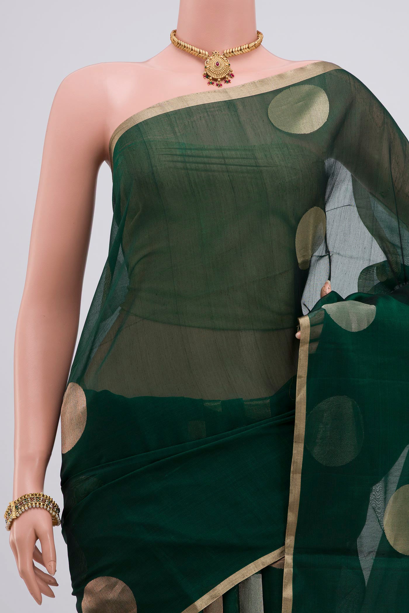 Border image of Green Silk Cotton Saree with Zari Butta on the body and Thin Zari Line. 