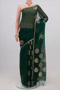 Green Silk Cotton Saree with Zari Butta on the body and Thin Zari Line.  displayed on a mannequin