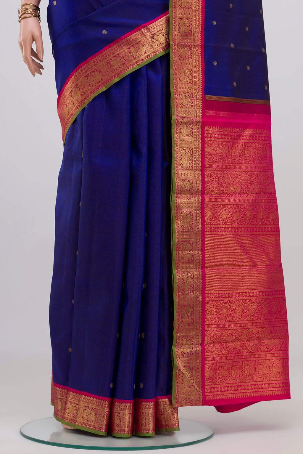 Pleats and pallu of Pure Silk Pure Zari Blue Kanjivaram Saree with Zari Butta on the body and Zari Border. 