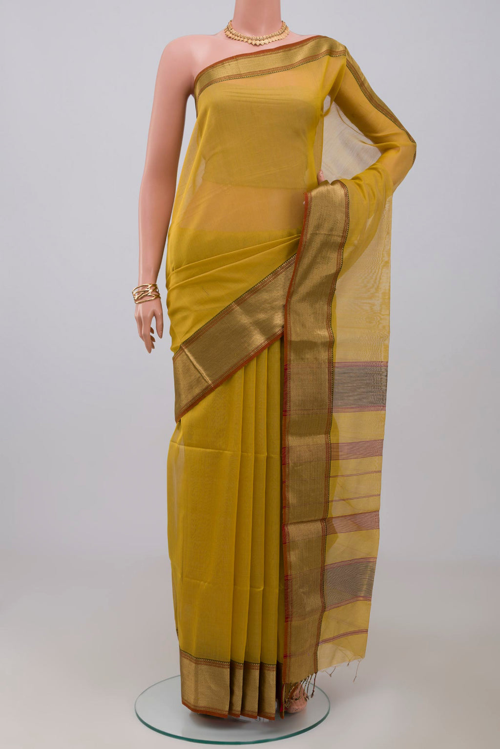 Lemon Yellow Maheshwari Silk Cotton Saree with Plain Body and Zari Border.  displayed on a mannequin