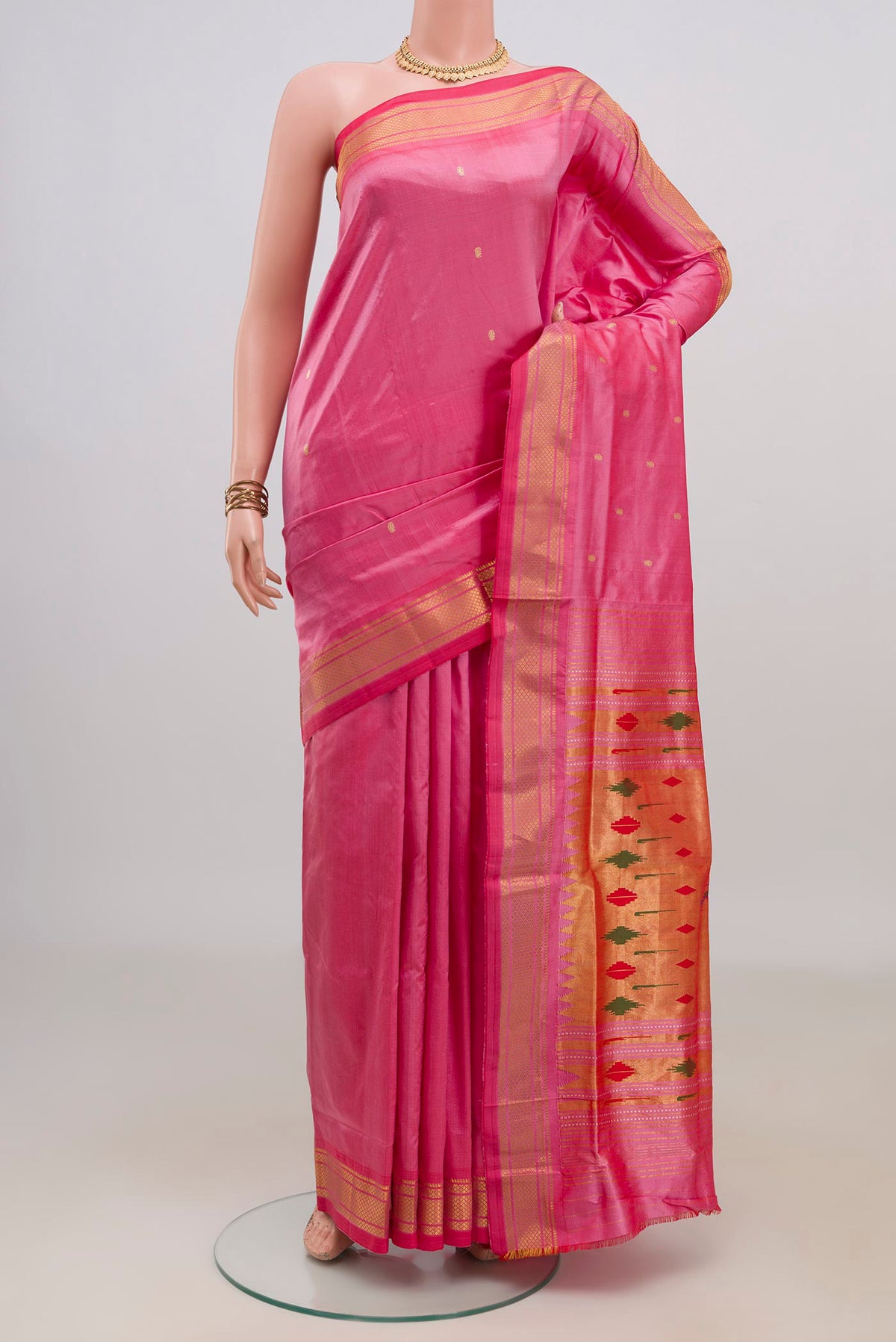 Pure Silk Pink Paithani Saree with Zari Butta on the body and Zari Border.  displayed on a mannequin