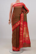 Pure Silk Green with Red Color Paithani Saree with Zari Butta on the body and Zari Border.  displayed on a mannequin