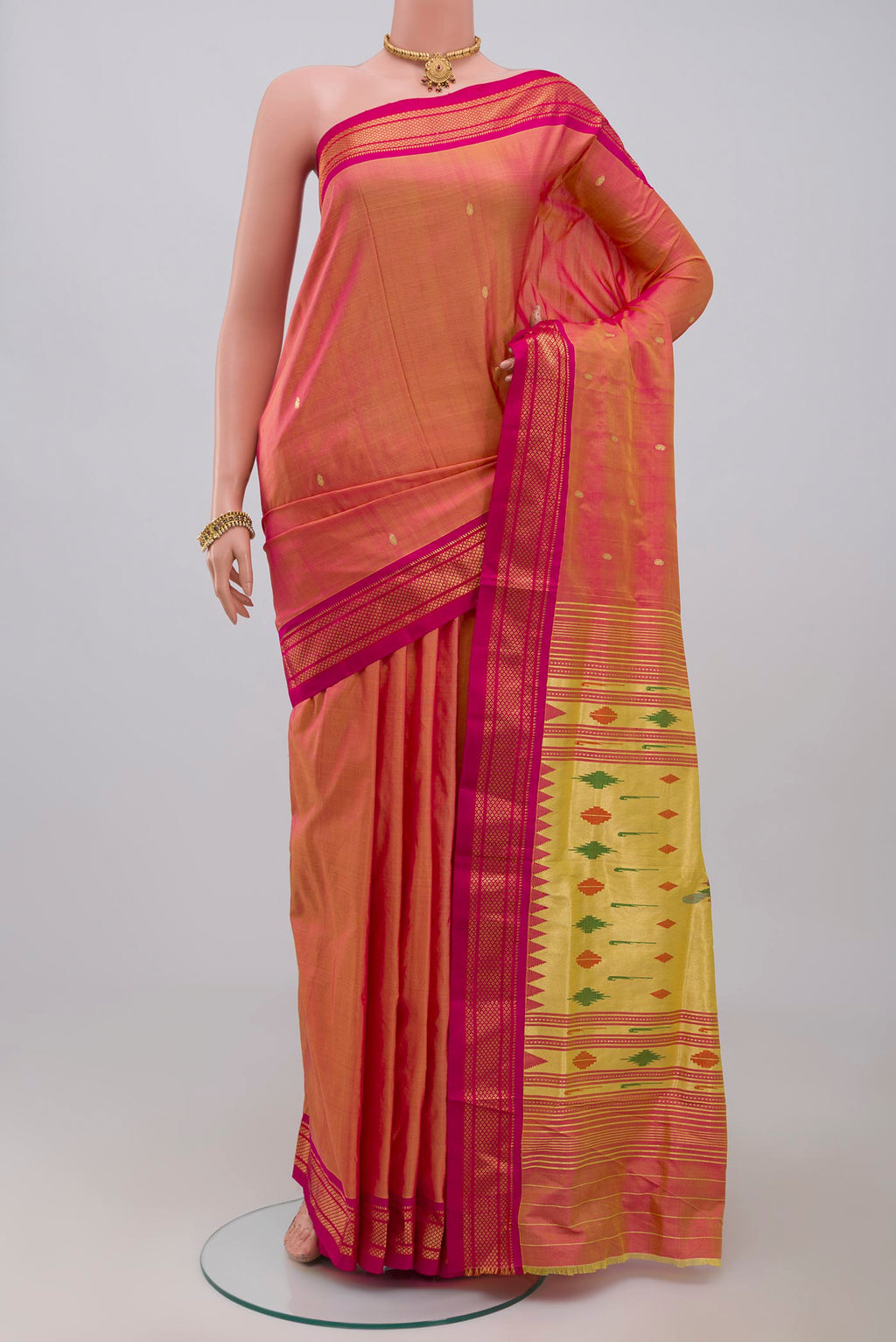 Pink Paithani Silk Saree with Zari Butta on the body and Zari Border.  displayed on a mannequin