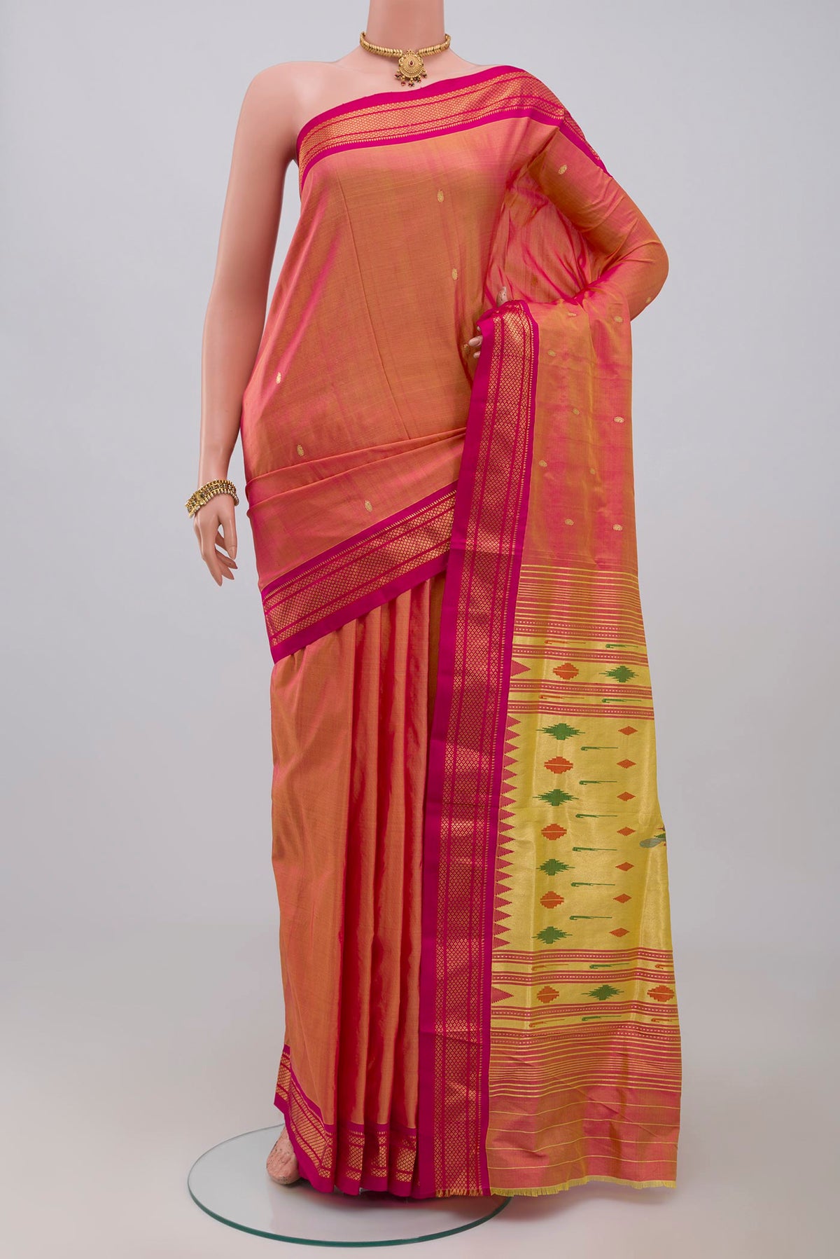 Pink Paithani Silk Saree with Zari Butta on the body and Zari Border.  displayed on a mannequin