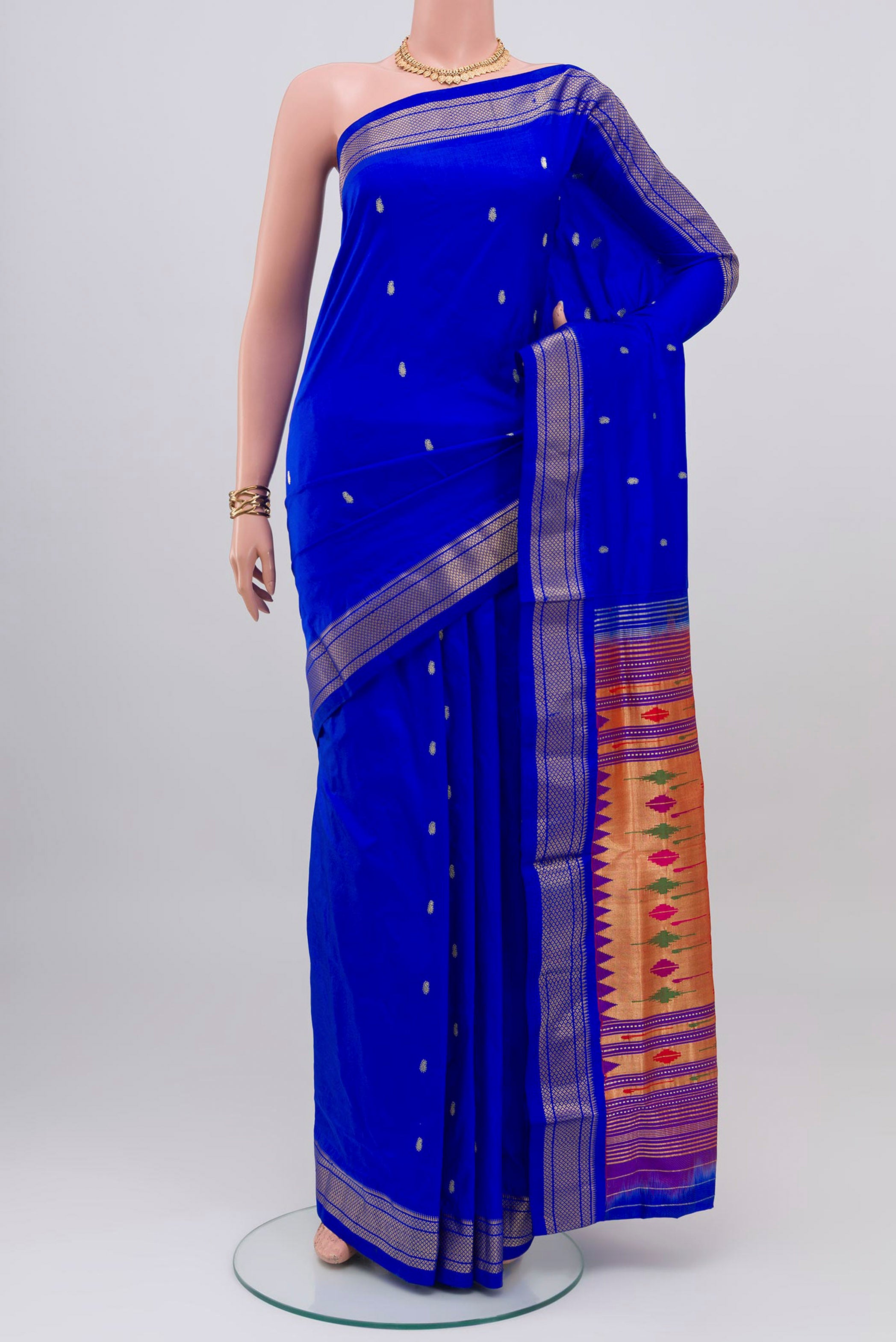 Royal Blue Paithani Silk Saree with Zari Butta on the body and Zari Border.  displayed on a mannequin