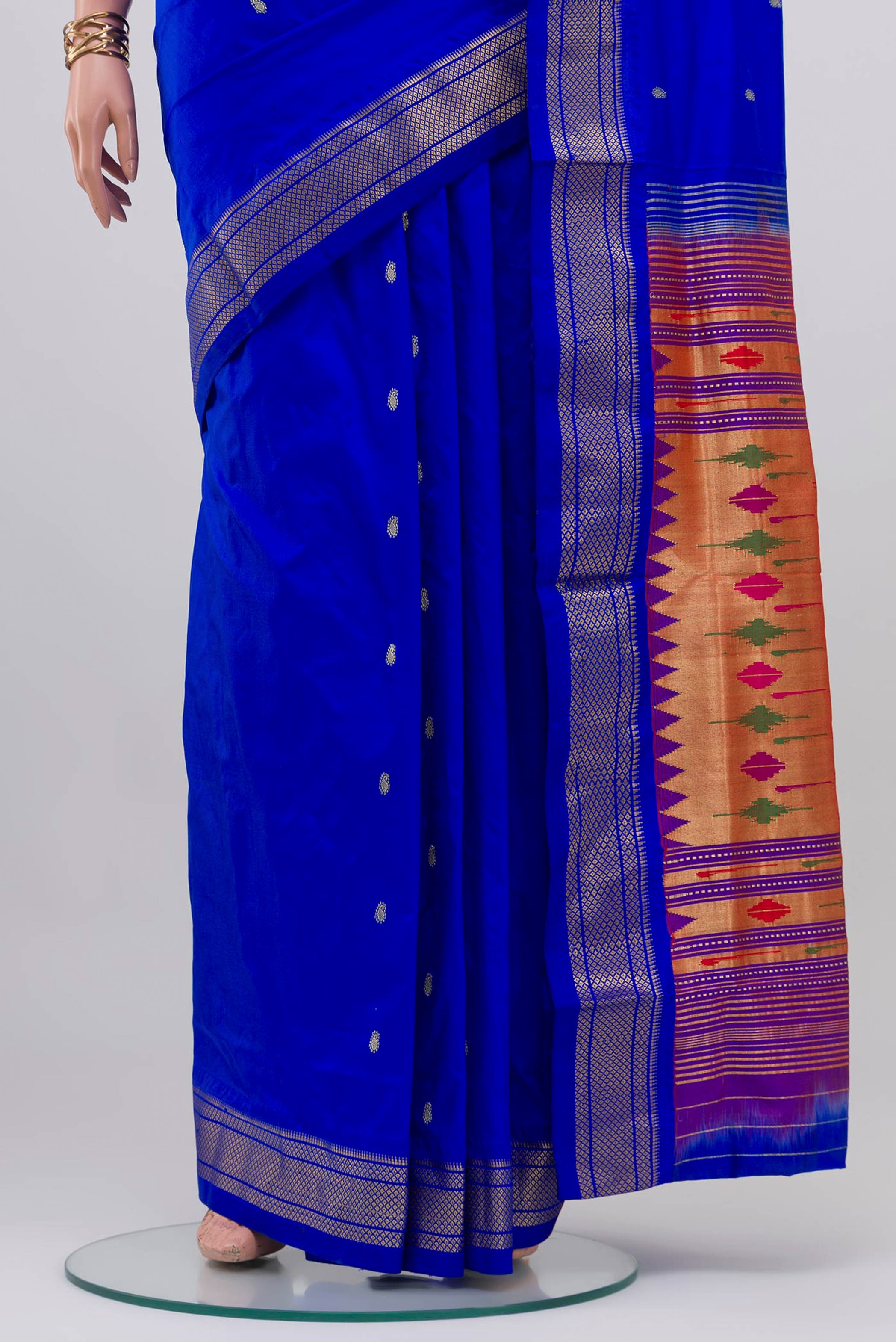 Pleats and pallu of Royal Blue Paithani Silk Saree with Zari Butta on the body and Zari Border. 