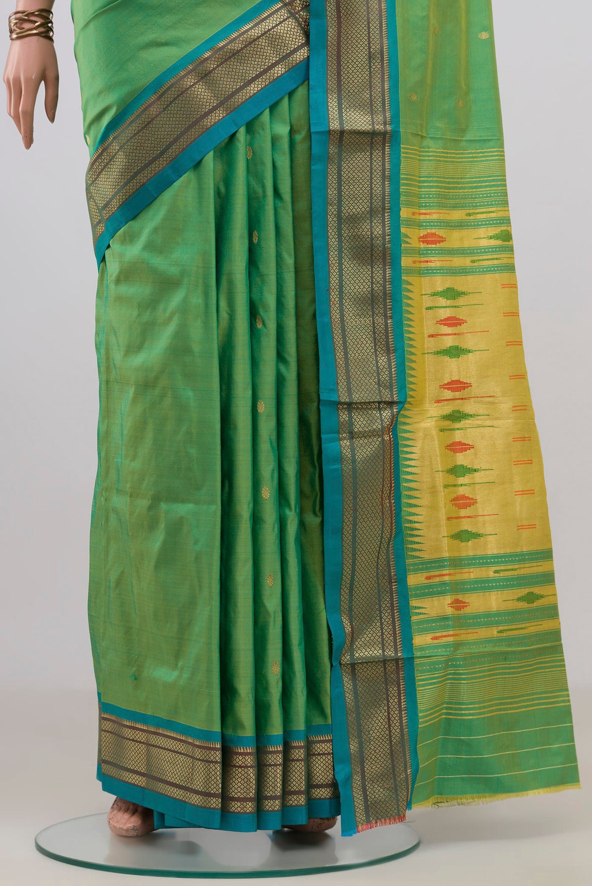 Pleats and pallu of Pure Silk Green Paithani Saree with Zari Butta on the body and Zari Border. 