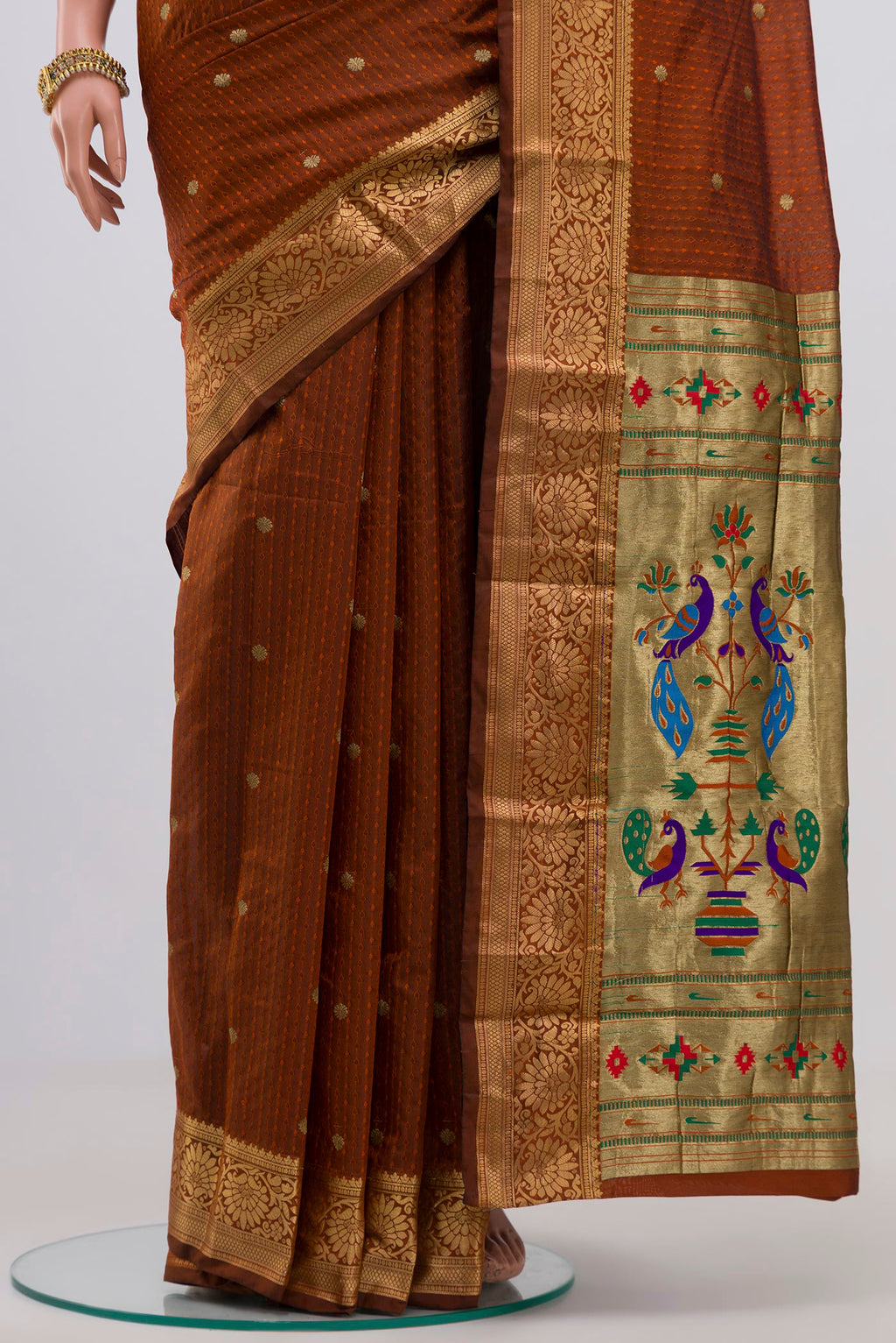 Pleats and pallu of Rust Bangalore Silk Saree with Jacquard With Zari Butta on the body and Zari Border. 