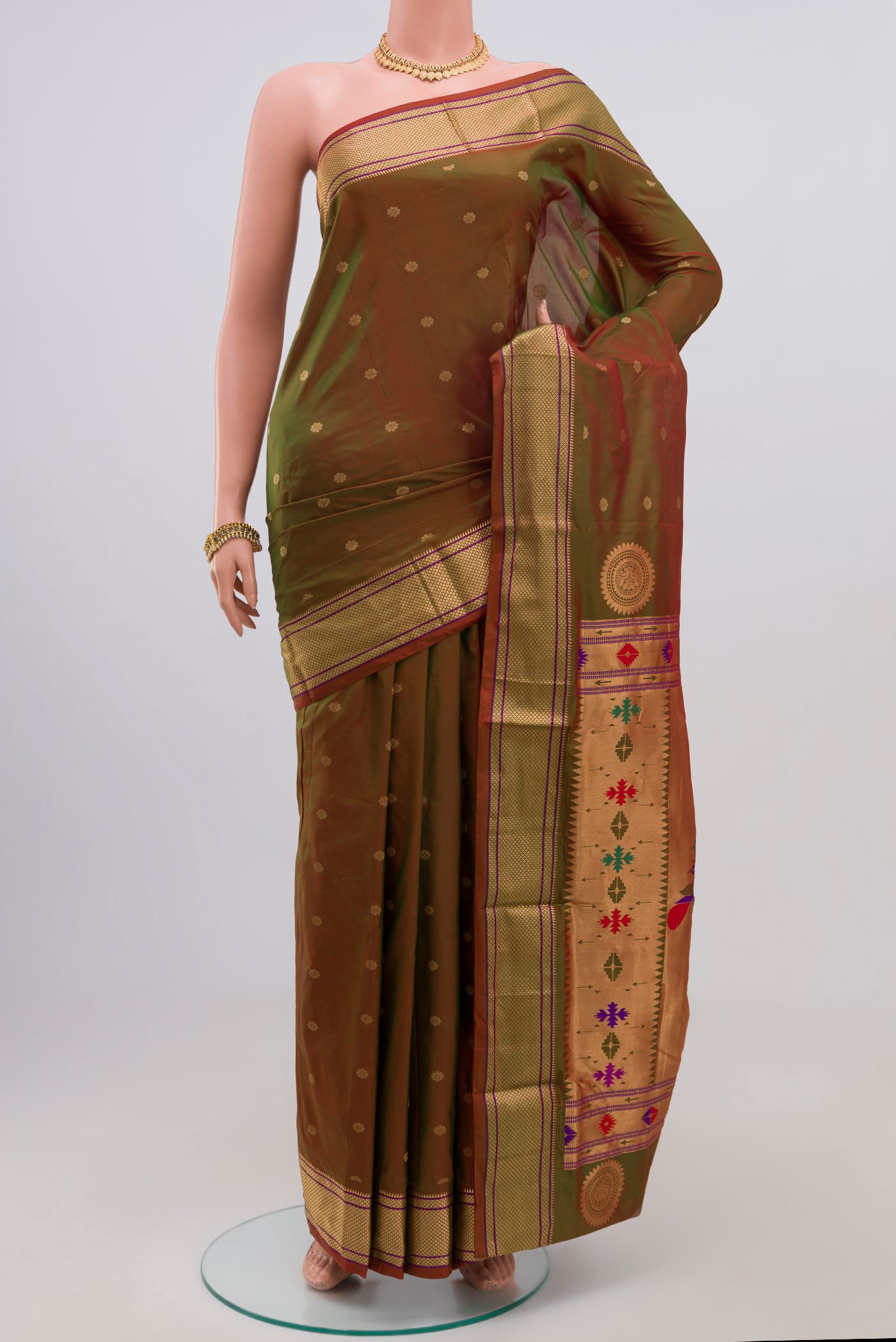 Green Bangalore Silk Saree with Zari Butta on the body and Zari Border.  displayed on a mannequin