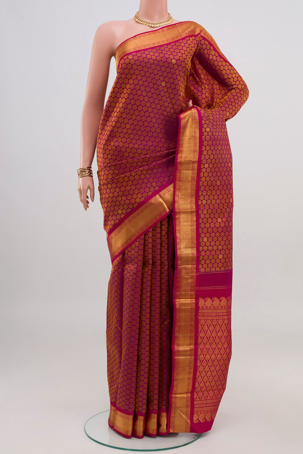 Pure Silk Pure Zari Magenta Kanjivaram Saree with Jacquard With Zari Butta on the body and Zari Border.  displayed on a mannequin