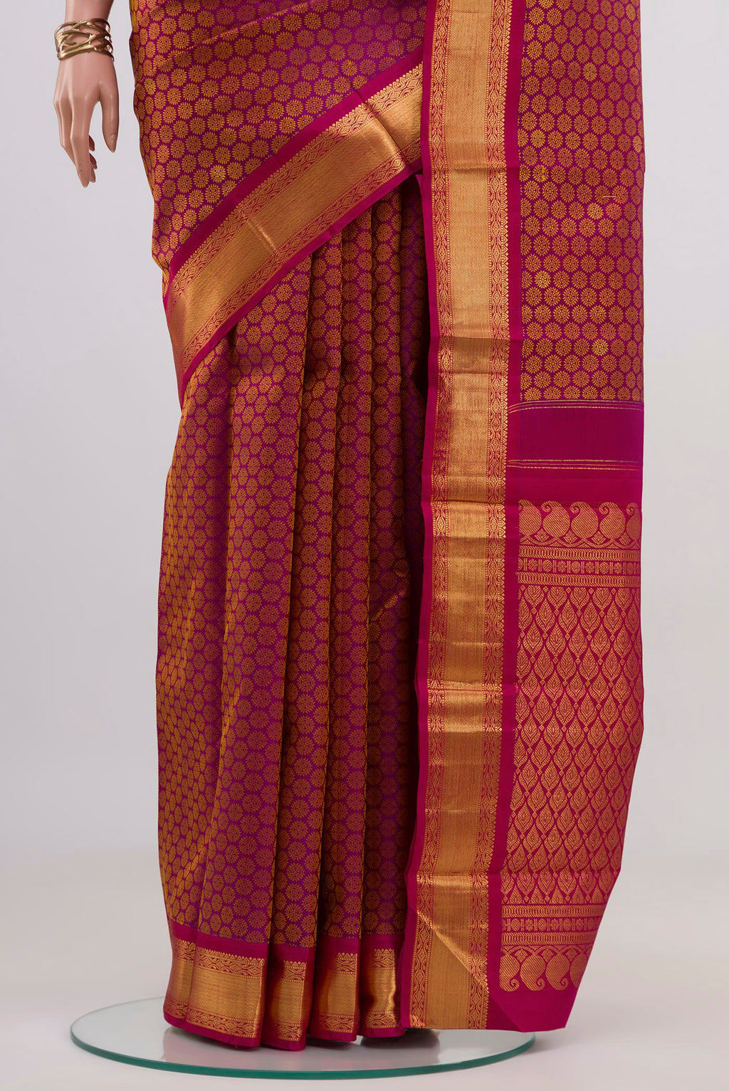 Pleats and pallu of Pure Silk Pure Zari Magenta Kanjivaram Saree with Jacquard With Zari Butta on the body and Zari Border. 