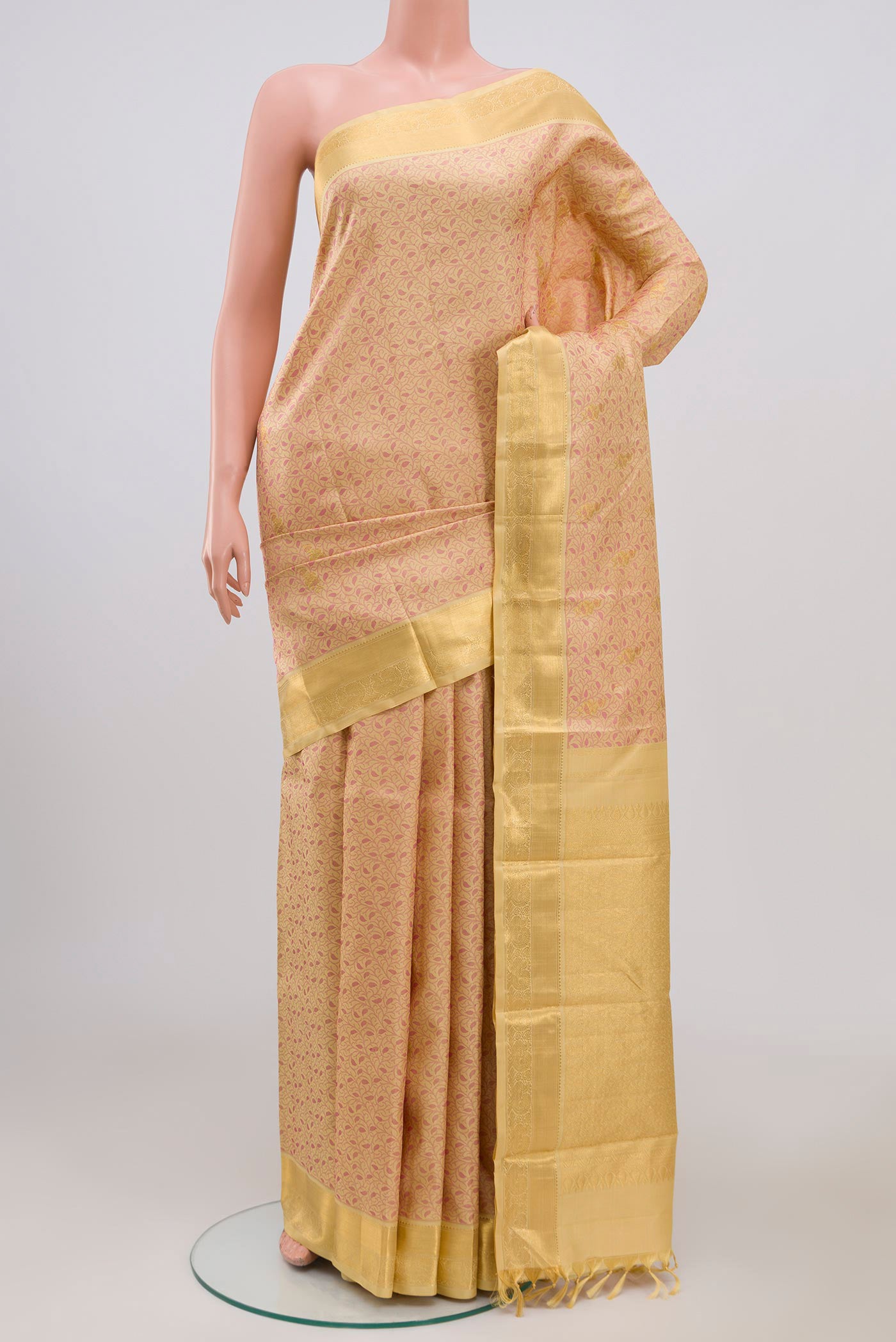 Pure Silk Pure Zari Beige Kanjivaram Saree with Jacquard With Zari Butta on the body and Zari Border.  displayed on a mannequin