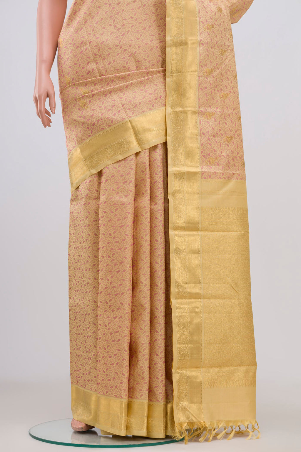 Pleats and pallu of Pure Silk Pure Zari Beige Kanjivaram Saree with Jacquard With Zari Butta on the body and Zari Border. 