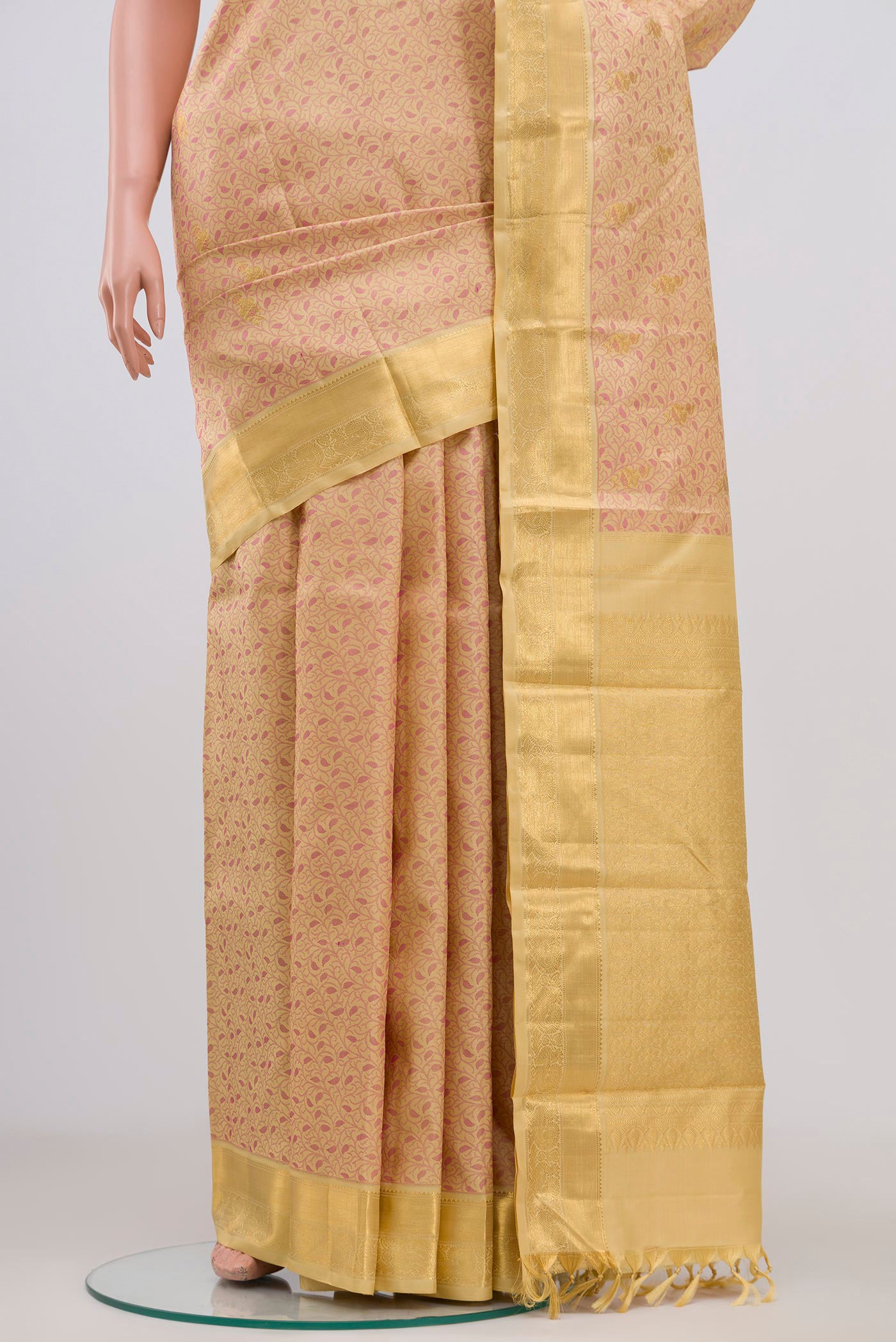 Pleats and pallu of Pure Silk Pure Zari Beige Kanjivaram Saree with Jacquard With Zari Butta on the body and Zari Border. 