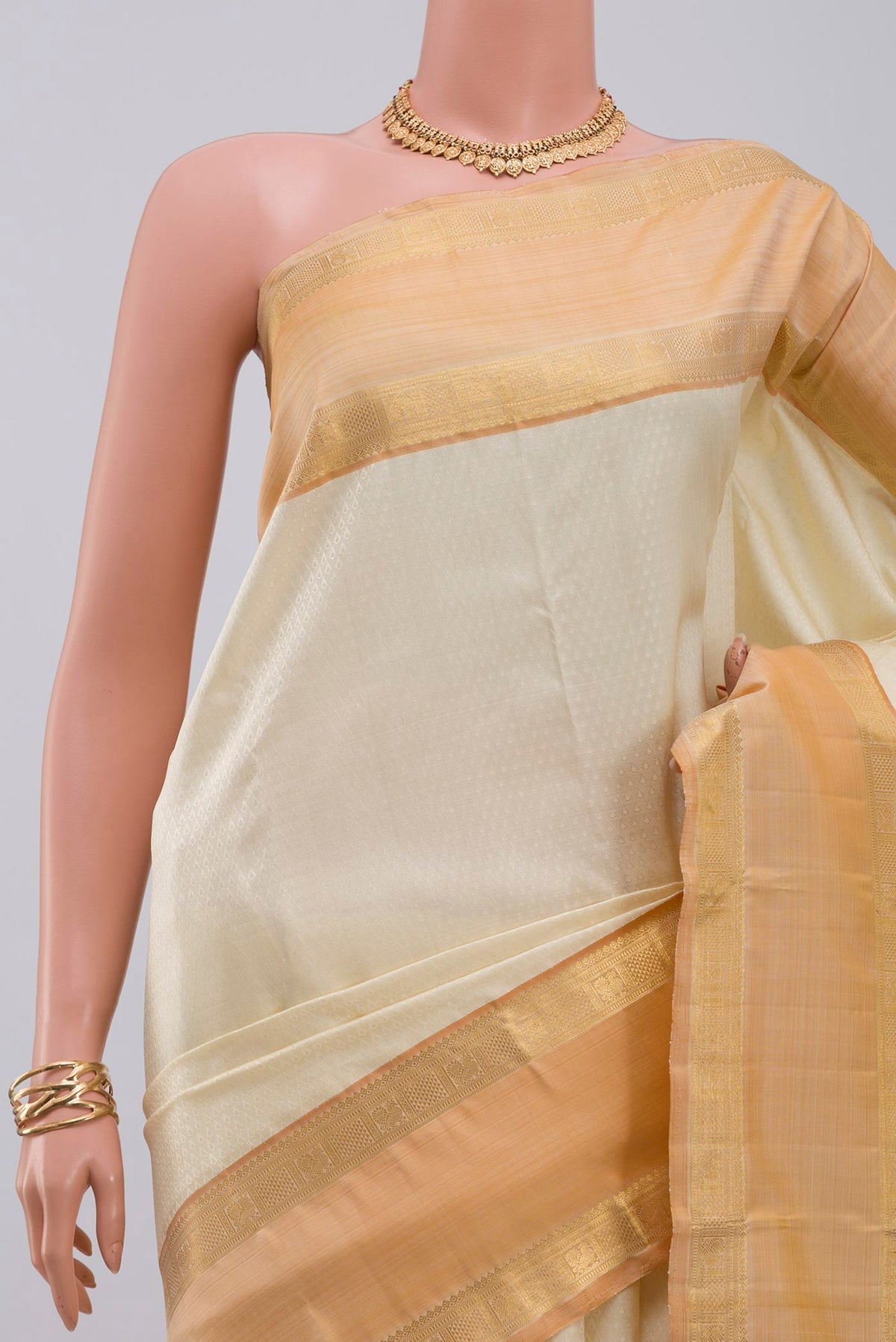 Border image of Cream Kanjivaram Saree with Jacquard design on the body and Zari Border. 