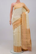 Cream Kanjivaram Saree with Jacquard design on the body and Zari Border.  displayed on a mannequin