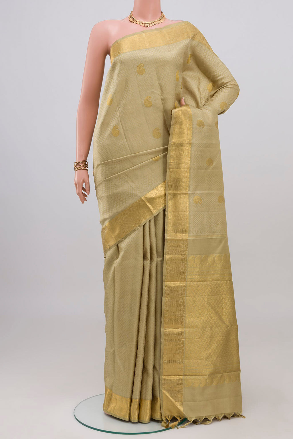 Pure Silk Pure Zari Green Kanjivaram Saree with Jacquard With Zari Butta on the body and Zari Border.  displayed on a mannequin