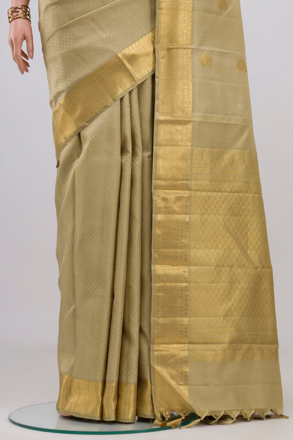 Pleats and pallu of Pure Silk Pure Zari Green Kanjivaram Saree with Jacquard With Zari Butta on the body and Zari Border. 