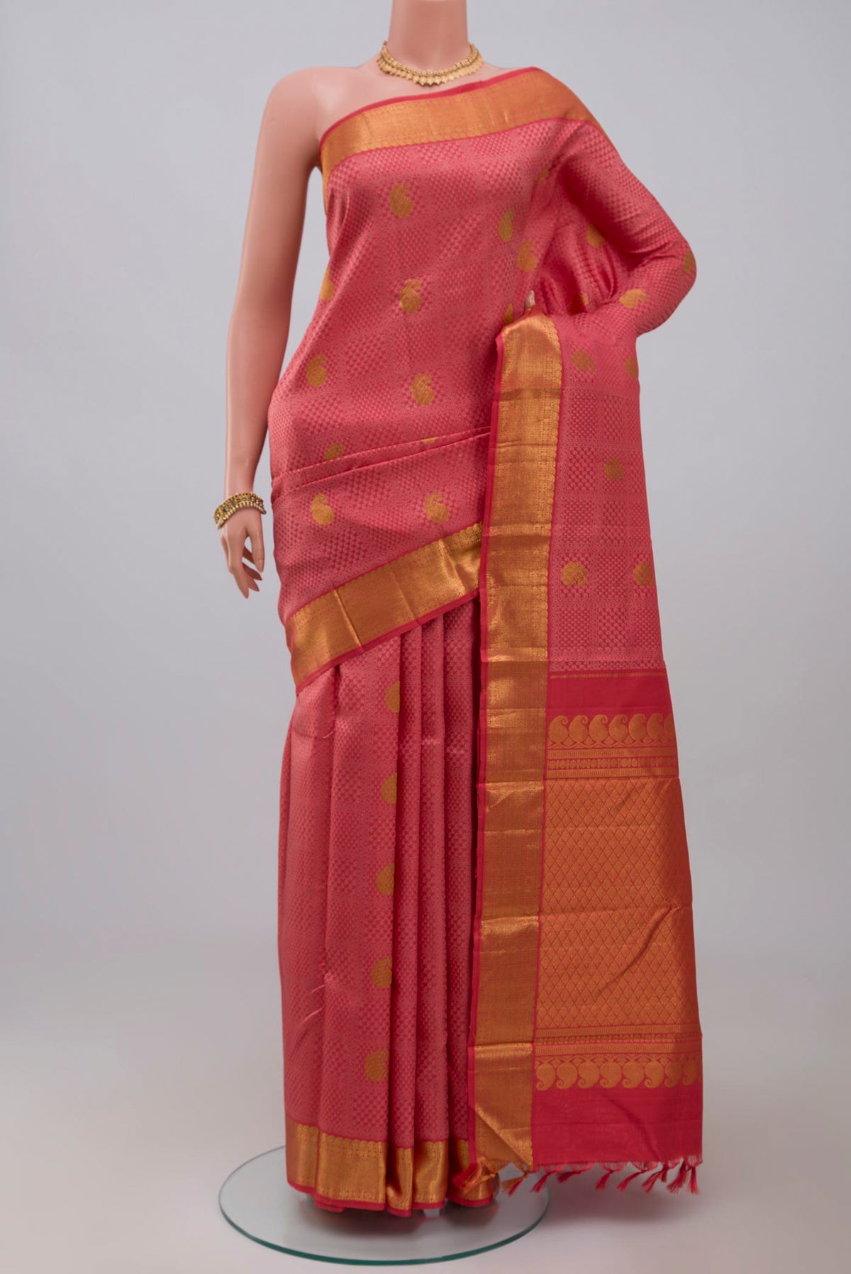 Pure Silk Pure Zari Pink Kanjivaram Saree with Jacquard With Zari Butta on the body and Zari Border.  displayed on a mannequin
