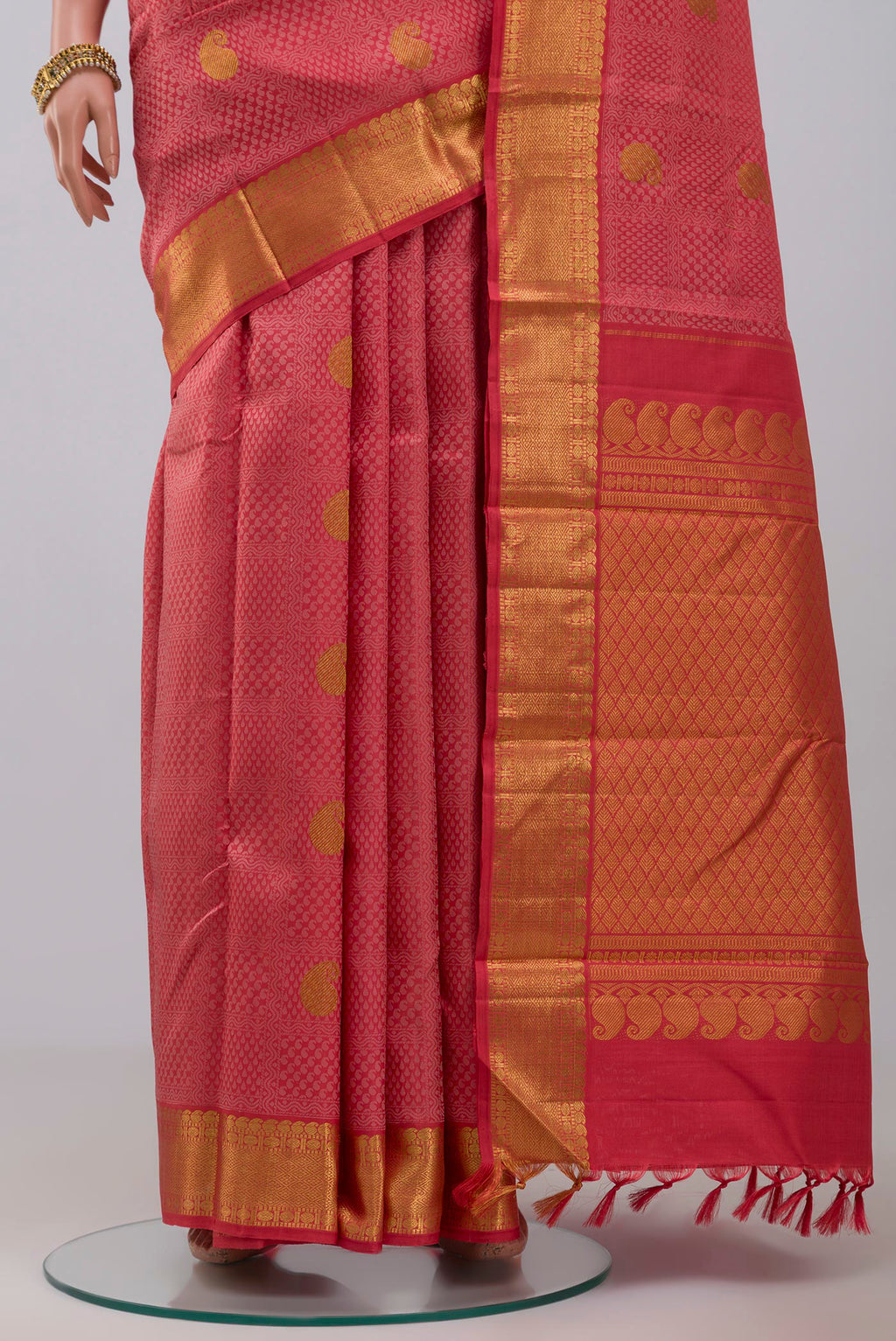 Pleats and pallu of Pure Silk Pure Zari Pink Kanjivaram Saree with Jacquard With Zari Butta on the body and Zari Border. 
