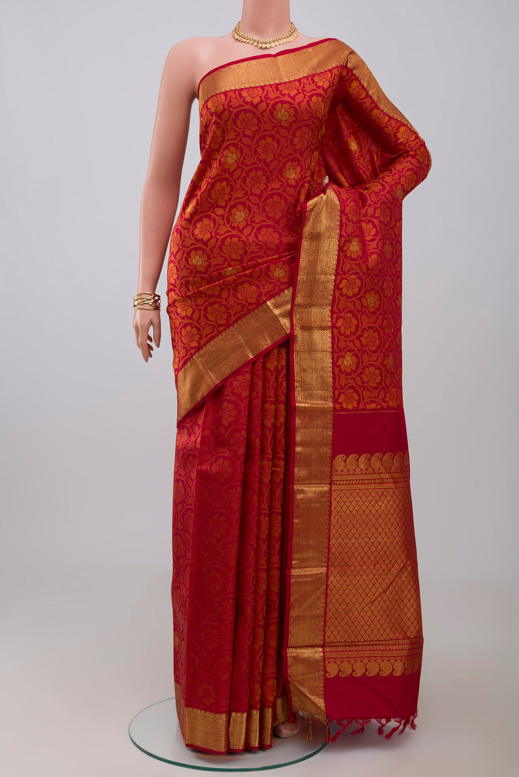 Maroon Kanjivaram Silk Saree with Jacquard With Zari Butta on the body and Zari Border.  displayed on a mannequin