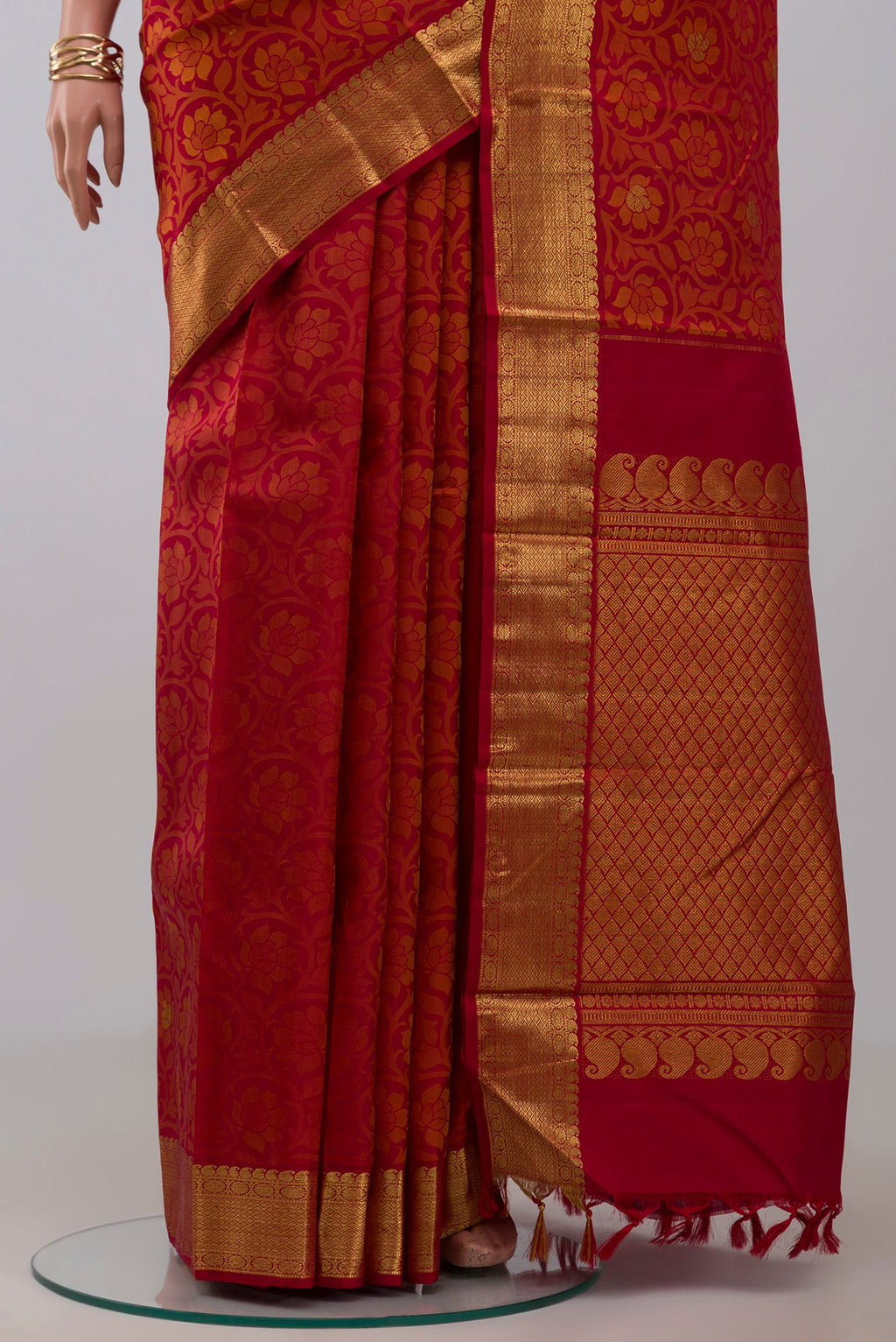 Pleats and pallu of Maroon Kanjivaram Silk Saree with Jacquard With Zari Butta on the body and Zari Border. 