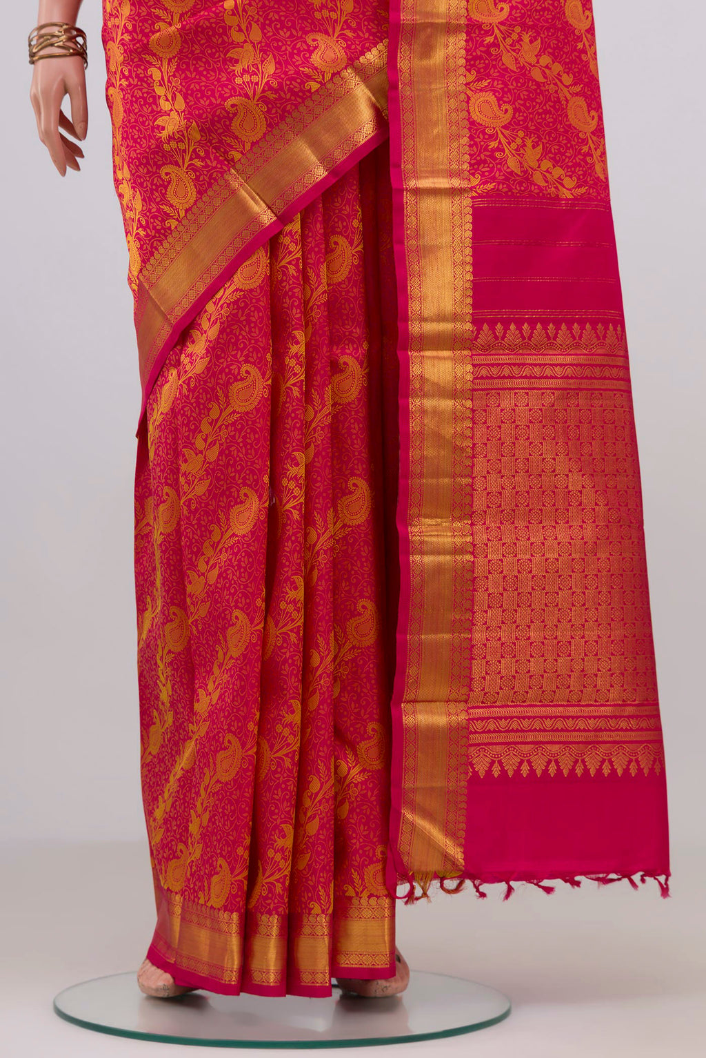 Pleats and pallu of Pink Kanjivaram Silk Saree with Jacquard design on the body and Zari Border. 