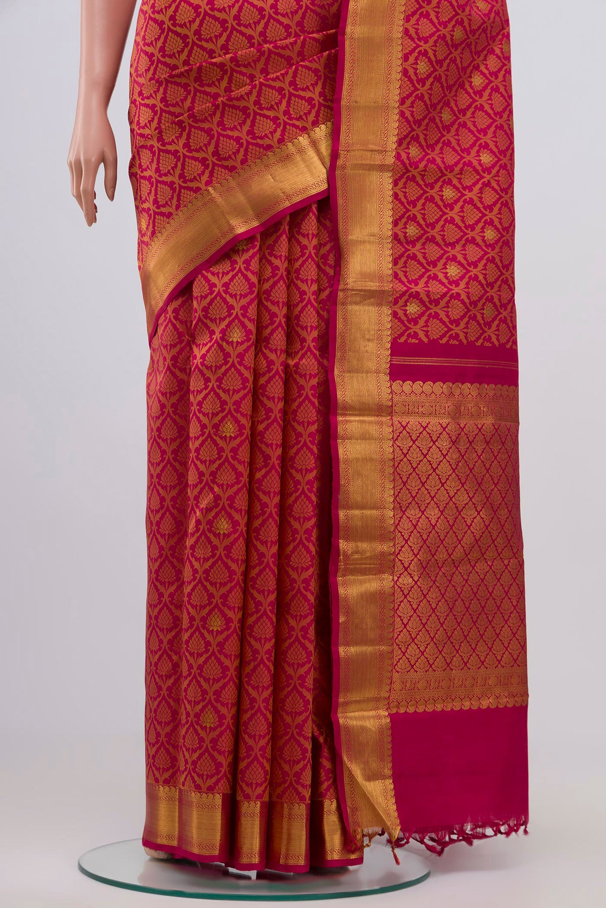 Pleats and pallu of Maroon Kanjivaram Silk Saree with Jacquard With Zari Butta on the body and Zari Border. 