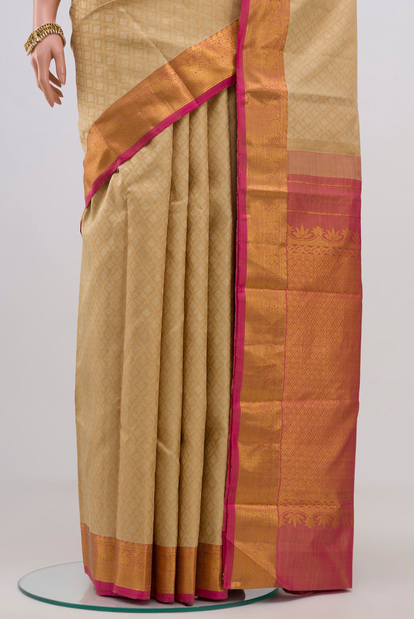 Pleats and pallu of Cream Kanjivaram Silk Saree with Jacquard design on the body and Zari Border. 