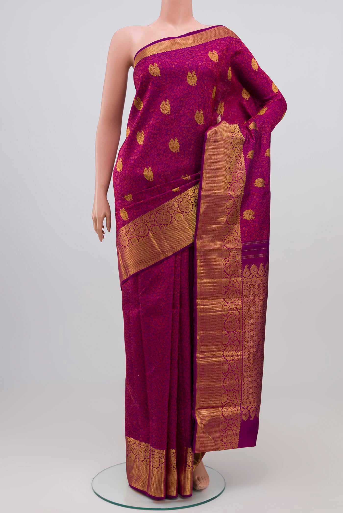 Purple Kanjivaram Silk Saree with Jacquard With Zari Butta on the body and Zari Border.  displayed on a mannequin