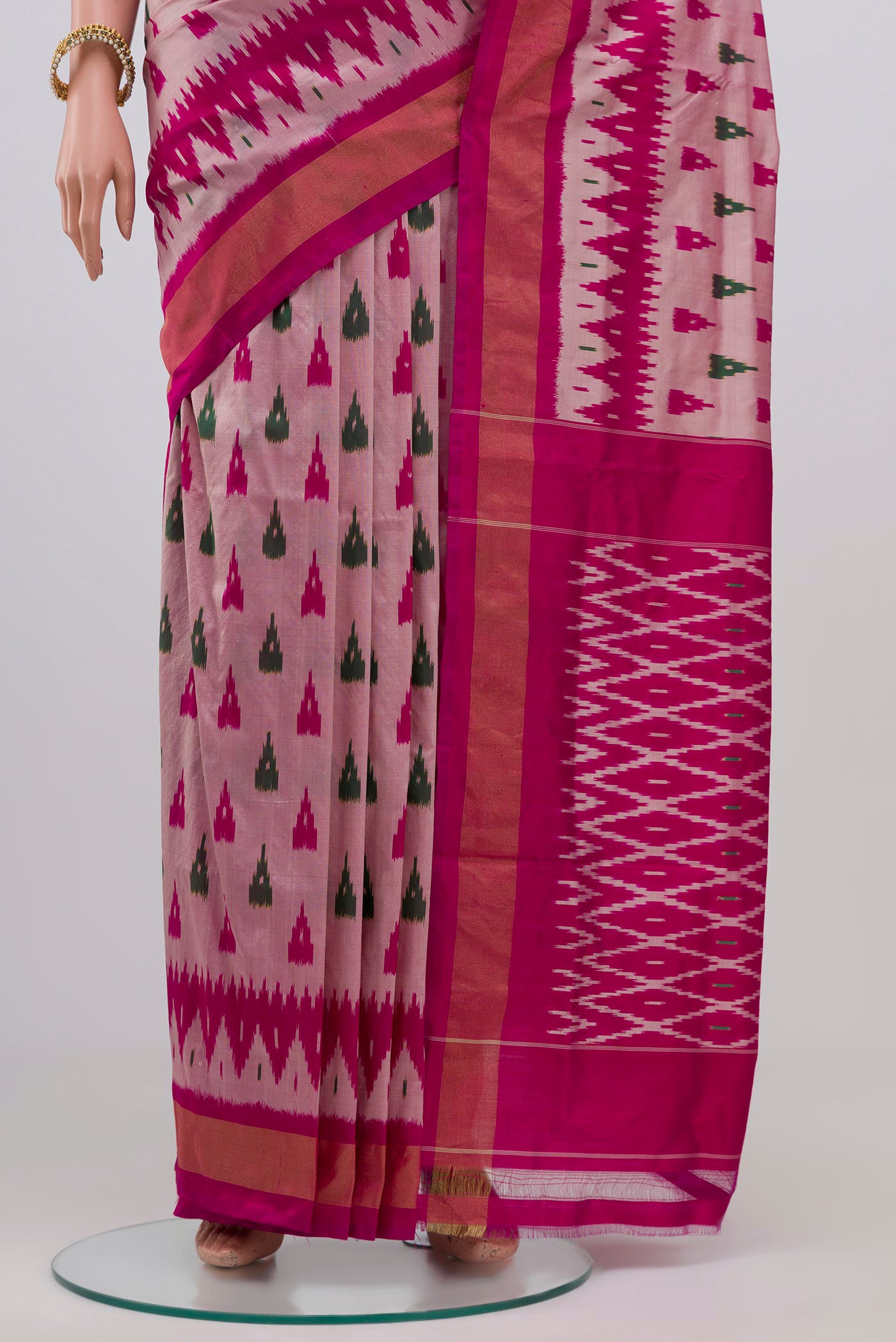 Pleats and pallu of Rose pink Pochampally Silk Saree with Ikat Print on the body and Zari Border. 