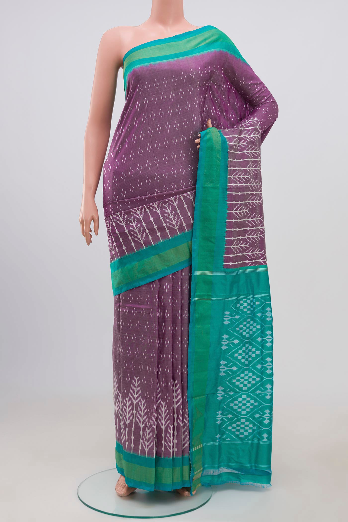 Lavender Pochampally Silk Saree with Ikat design on the body and Zari Border.  displayed on a mannequin