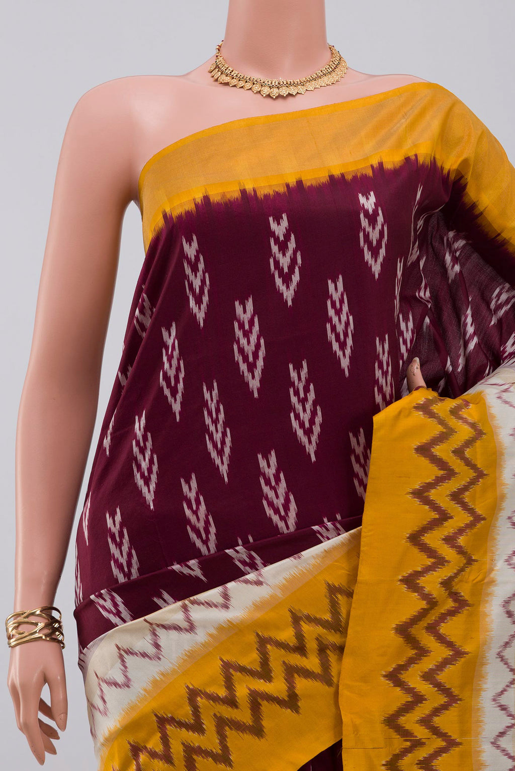 Border image of Brown Pochampally Saree with Ikat Print on the body and Ikat Border. 