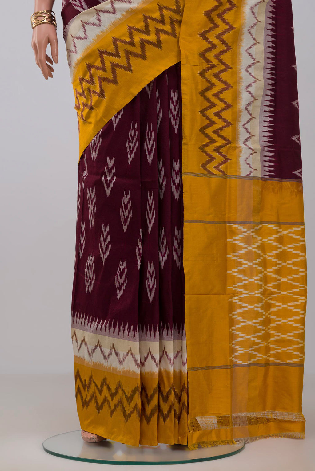 Pleats and pallu of Brown Pochampally Saree with Ikat Print on the body and Ikat Border. 