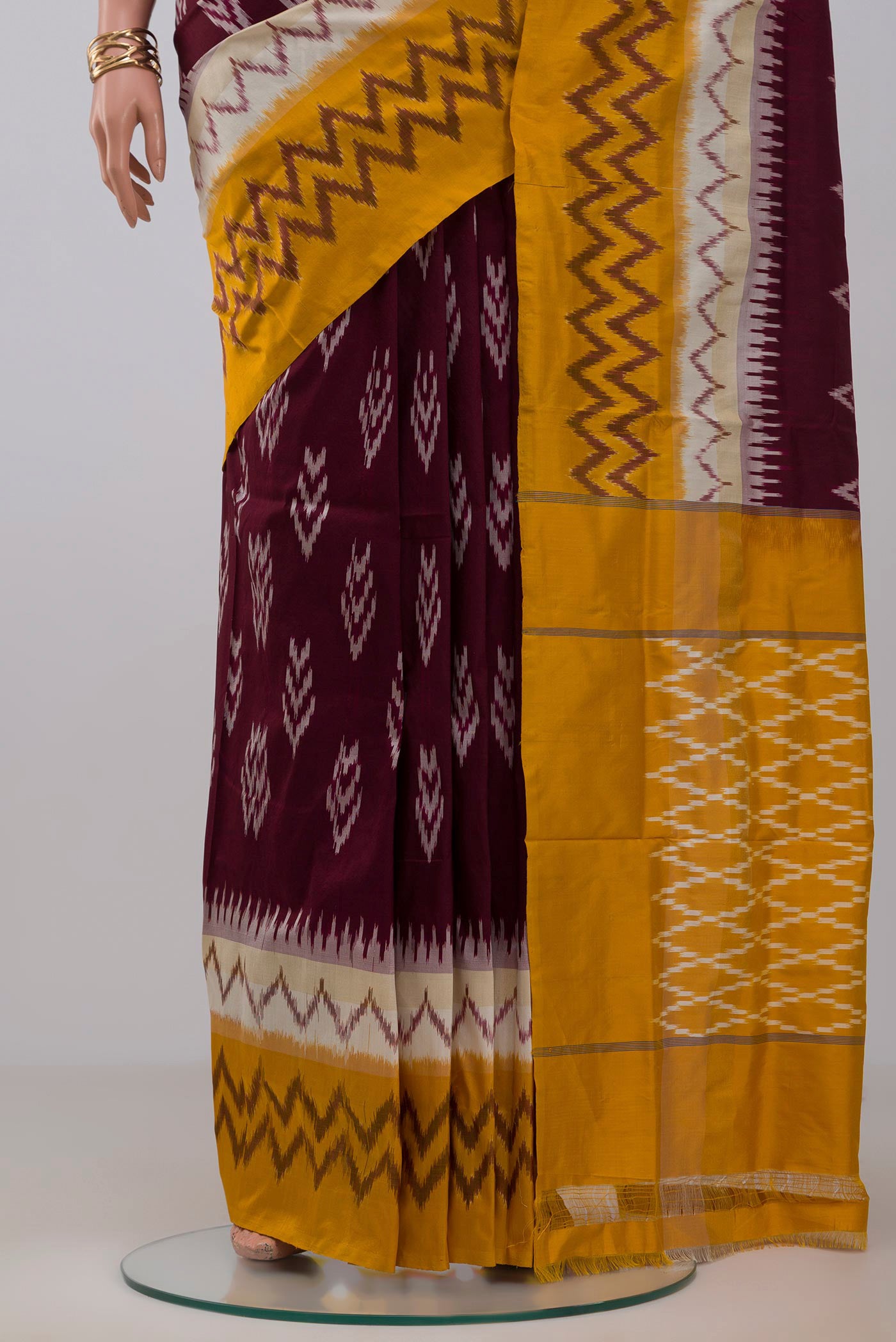 Pleats and pallu of Brown Pochampally Saree with Ikat Print on the body and Ikat Border. 