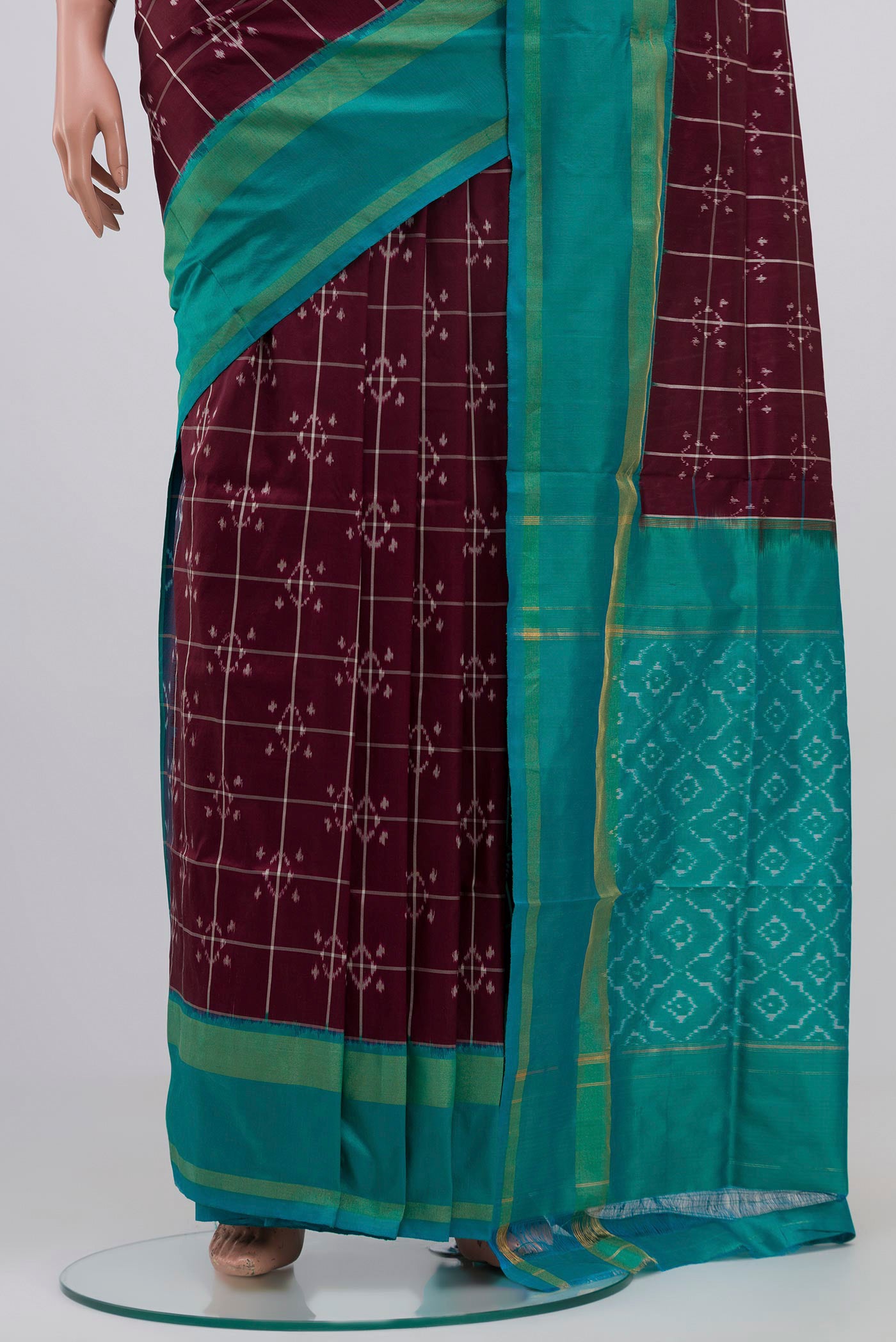Pleats and pallu of Brown Pochampally Silk Saree with Ikat Print on the body and Zari Border. 