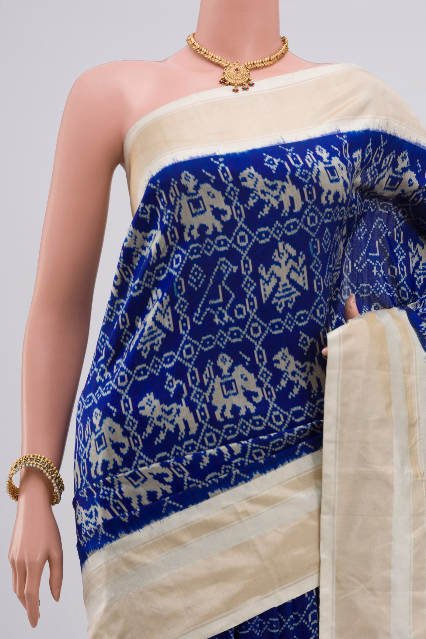 Border image of Navy Blue Pochampally Silk Saree with Ikat Print on the body and Zari Border. 