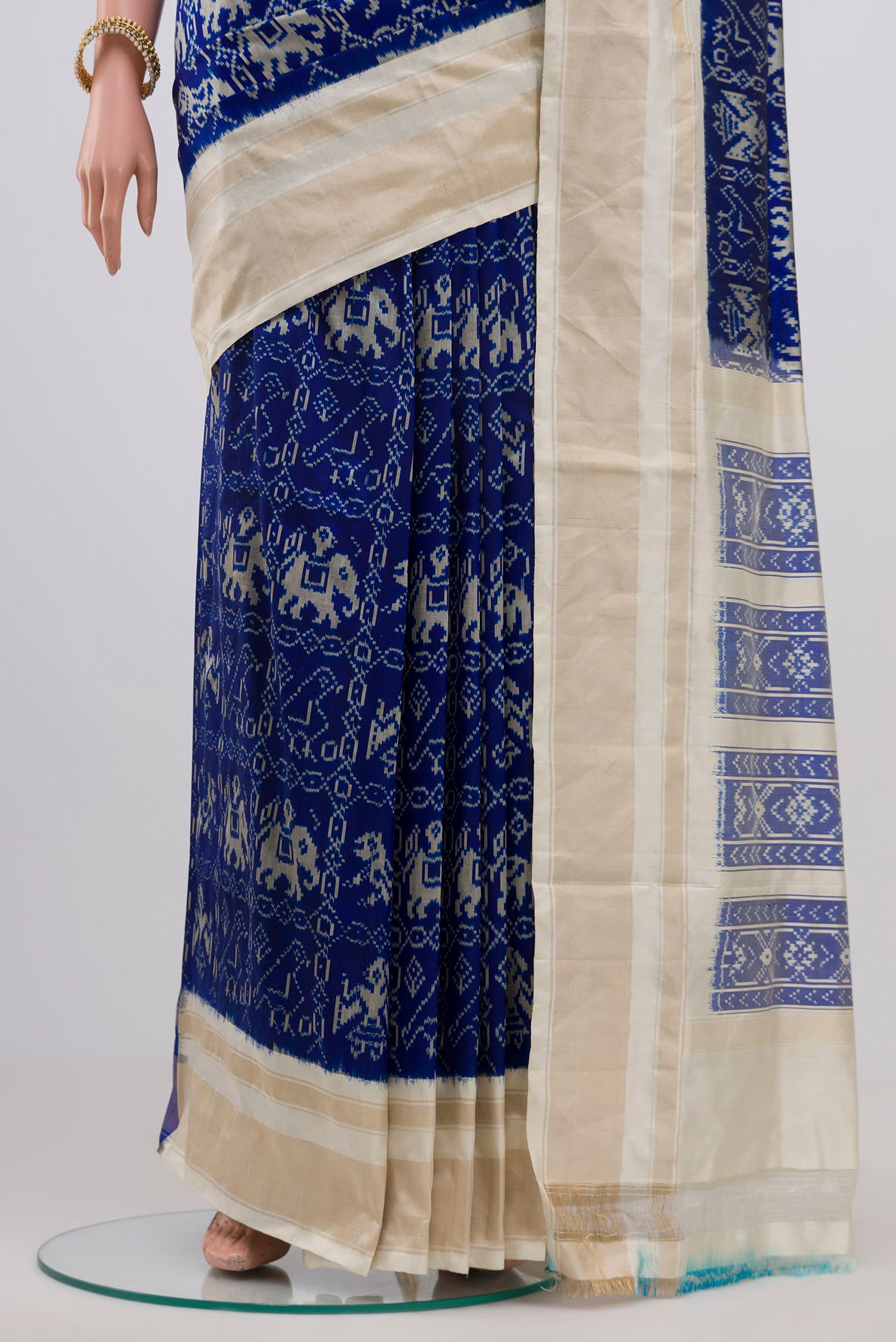 Pleats and pallu of Navy Blue Pochampally Silk Saree with Ikat Print on the body and Zari Border. 
