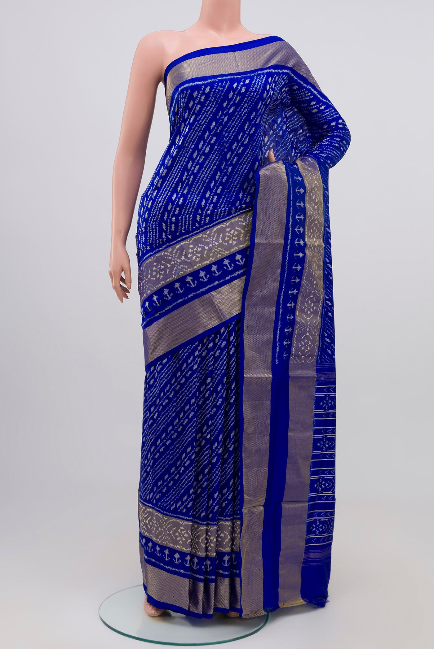 Blue Pochampally Silk Saree with Ikat Print on the body and Zari Border.  displayed on a mannequin