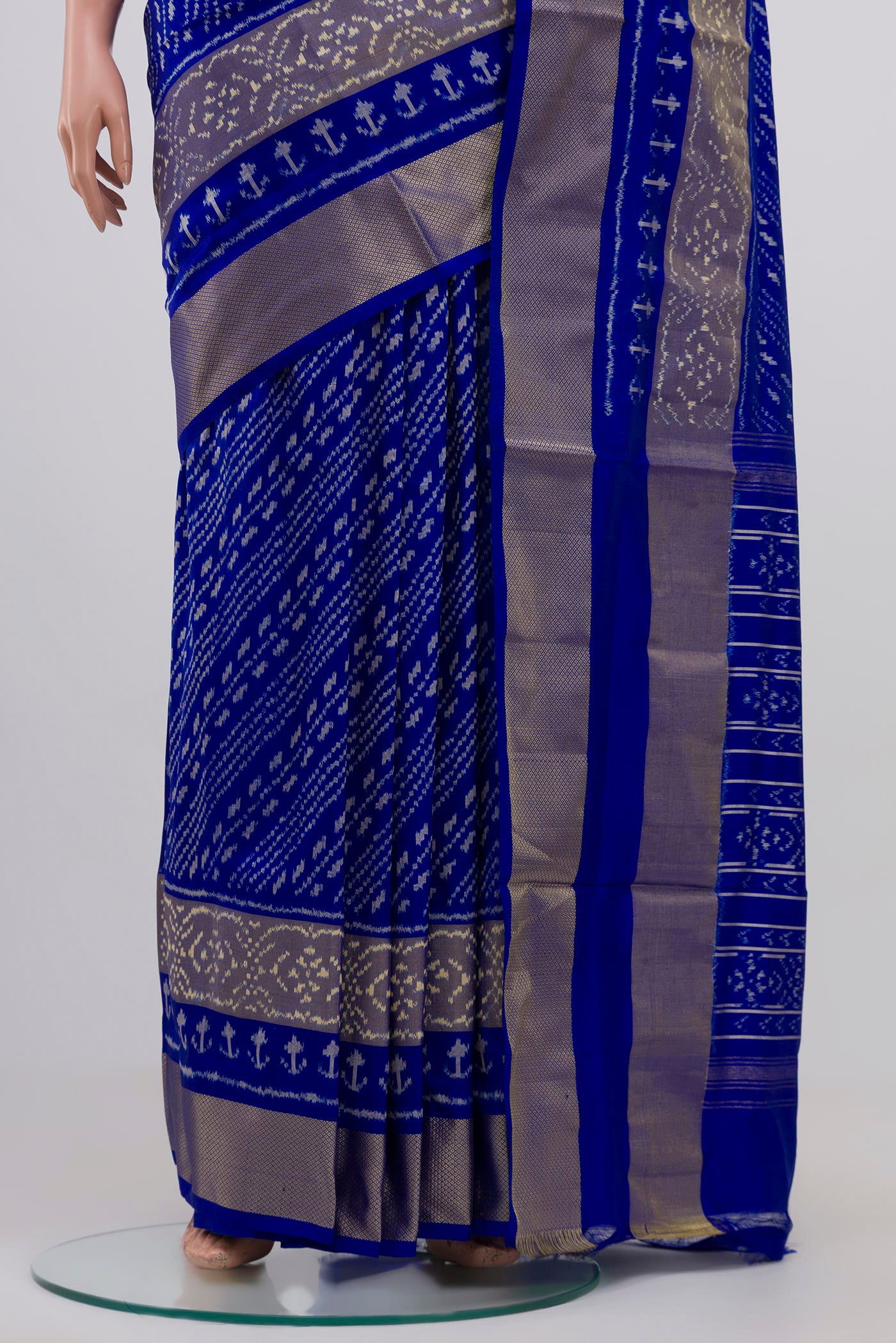 Pleats and pallu of Blue Pochampally Silk Saree with Ikat Print on the body and Zari Border. 
