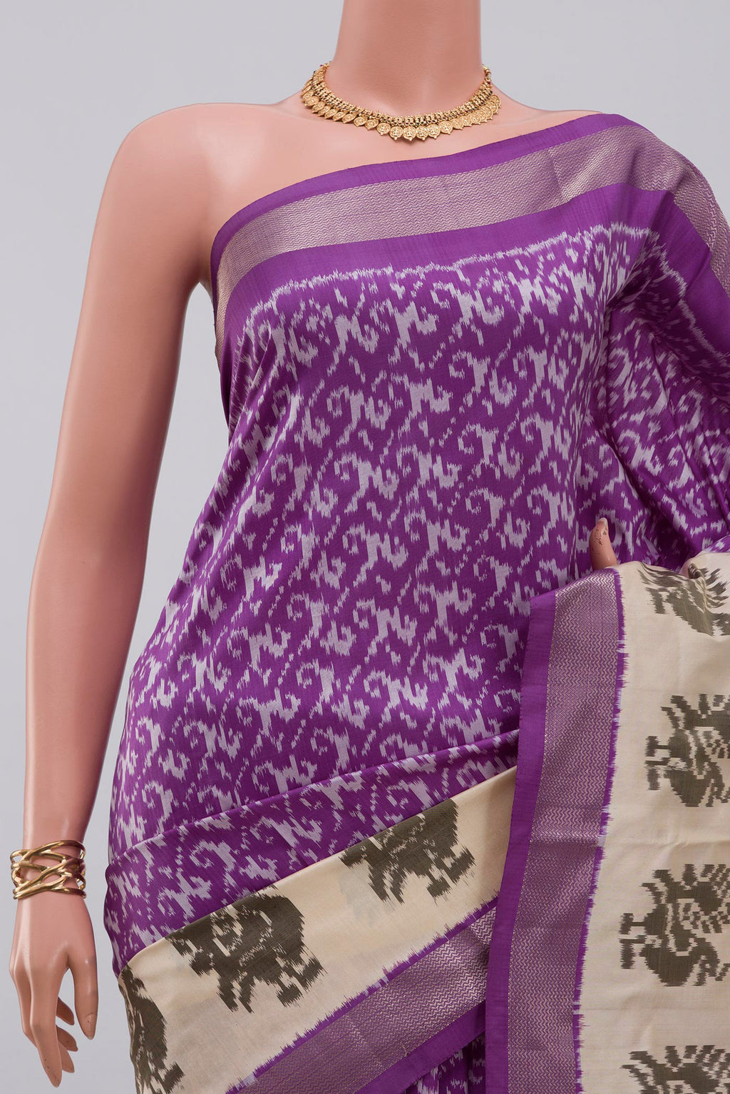 Border image of Purple Pochampally Saree with Ikat design on the body and Zari Border. 