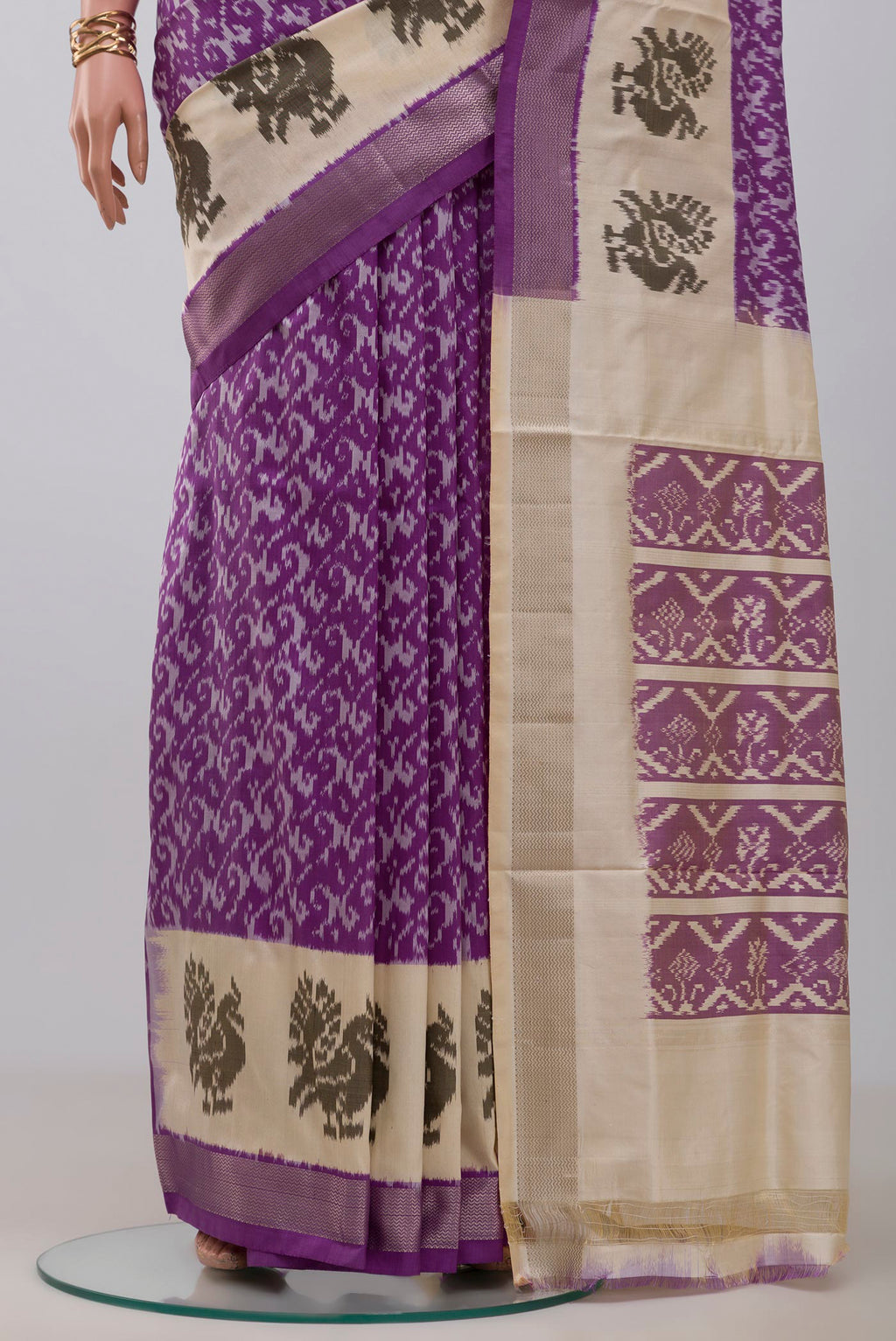 Pleats and pallu of Purple Pochampally Saree with Ikat design on the body and Zari Border. 