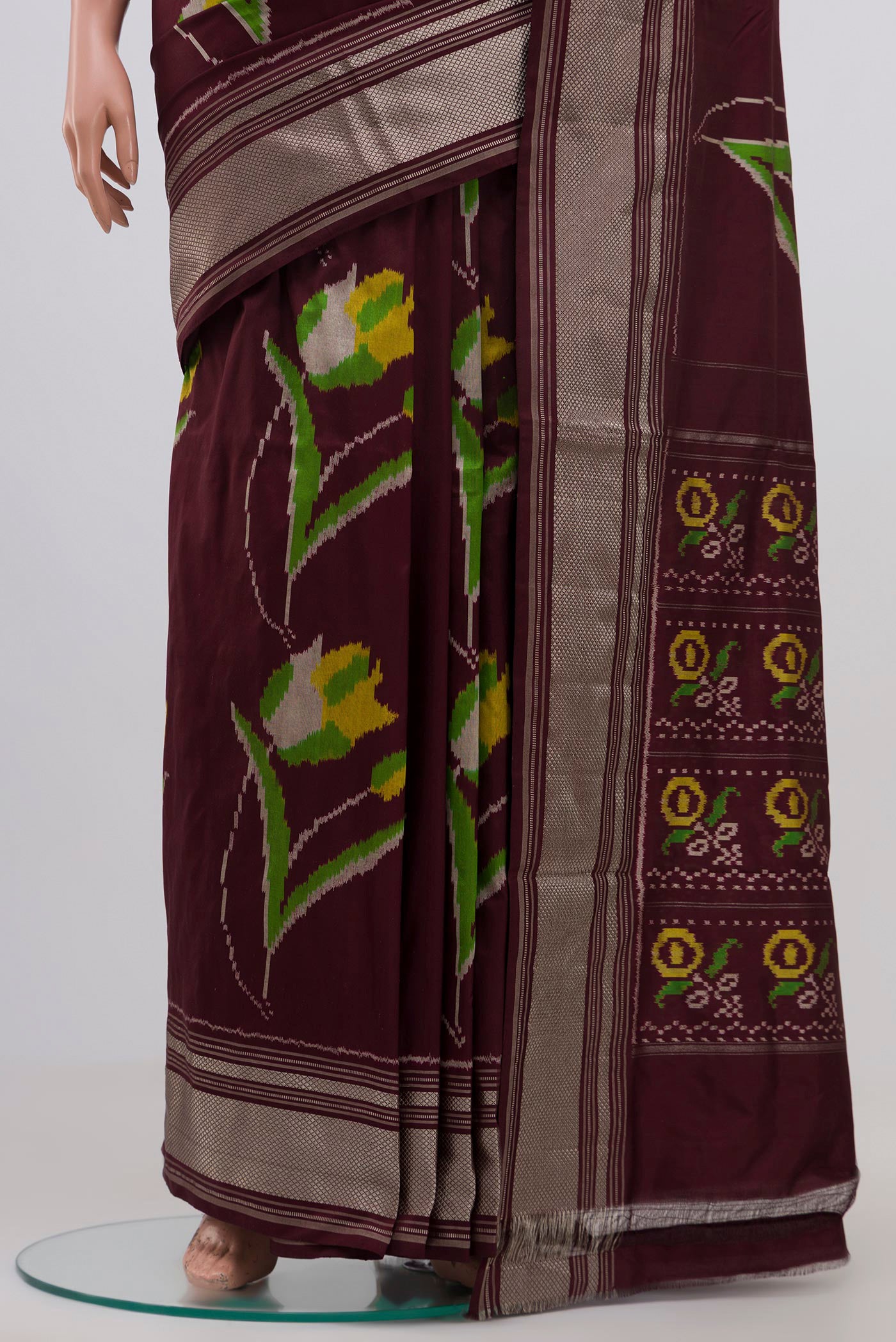 Pleats and pallu of Brown Pochampally Silk Saree with Ikat Print on the body and Zari Border. 